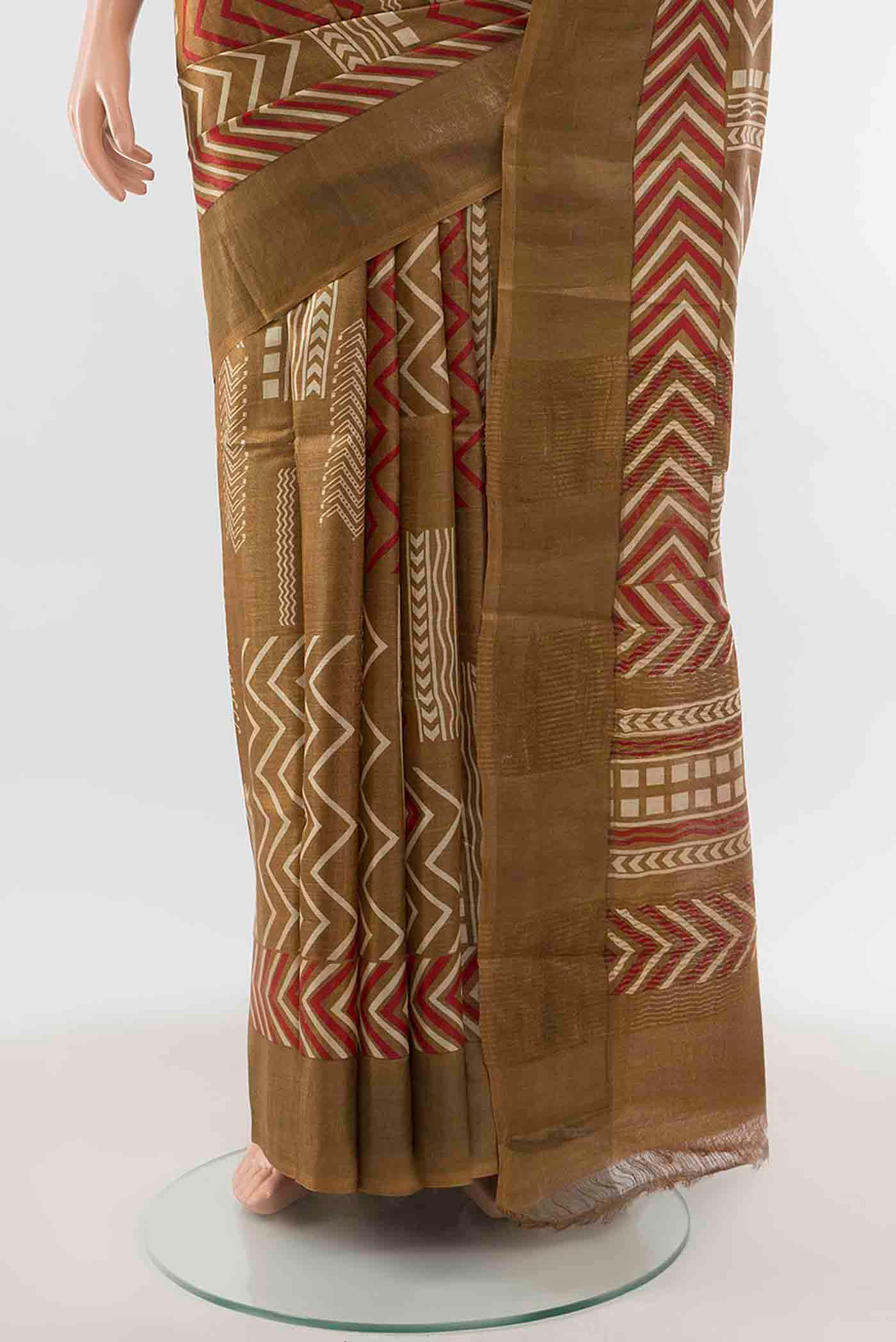 Pleats and pallu of Mehandi Green Tussar Silk Saree with Zari Brocade on the body and Silk Border