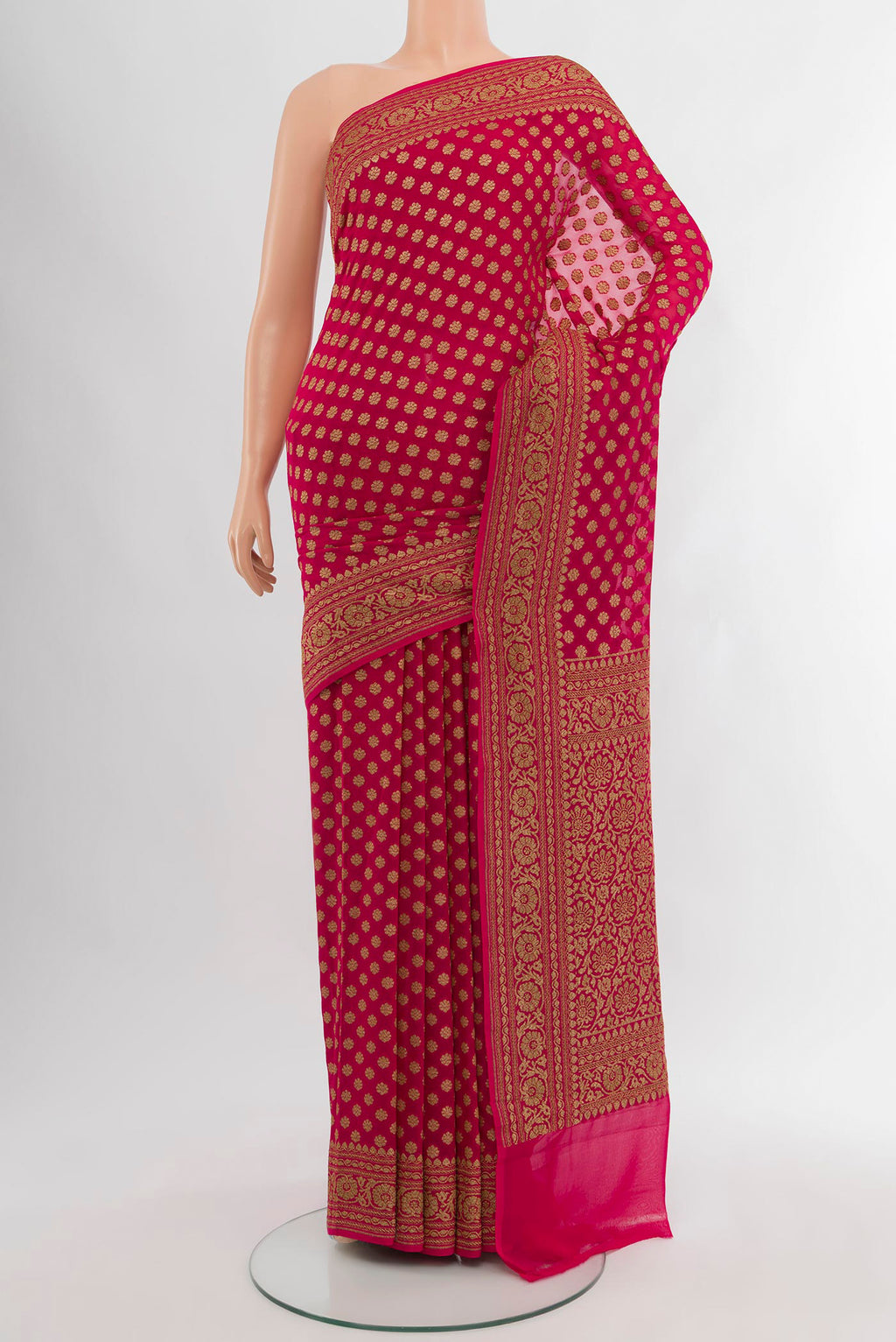 Dark Pink Banarasi Georgette Saree with Zari Butta on the body and Zari Border.  displayed on a mannequin
