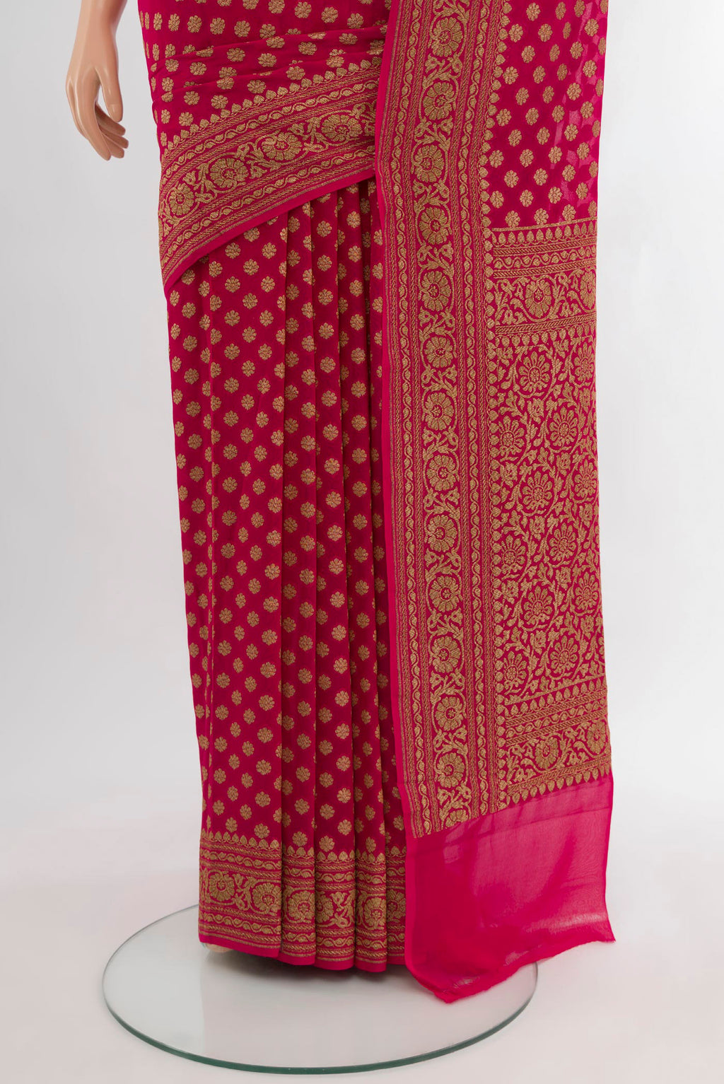 Pleats and pallu of Dark Pink Banarasi Georgette Saree with Zari Butta on the body and Zari Border. 