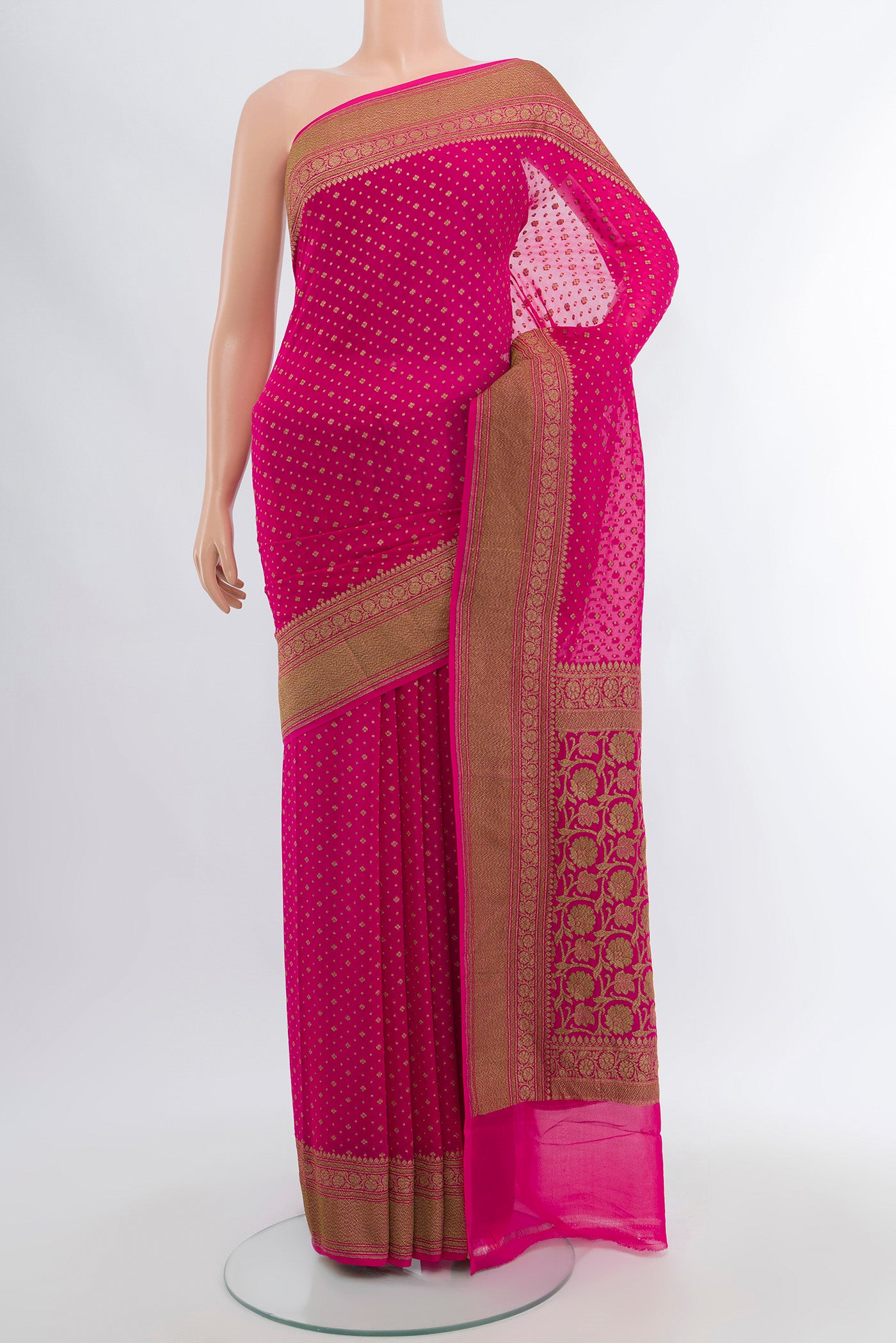 Rani Pink Banarasi Georgette Saree with Zari Butta on the body and Silk Border.  displayed on a mannequin