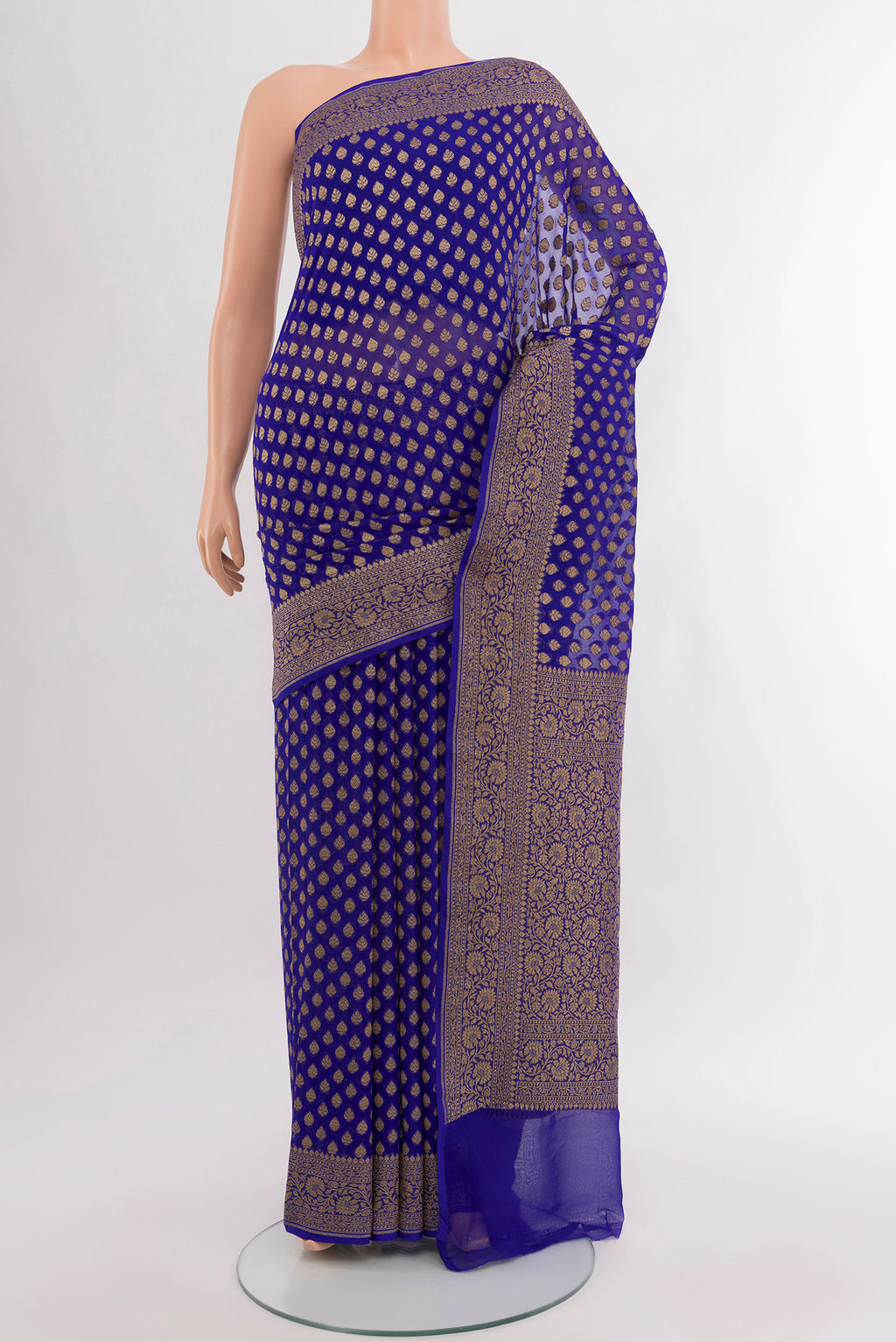 Pure Silk Pure Zari Dark Blue Banarasi Georgette Saree with Zari Butta on the body and Silk Border.  displayed on a mannequin
