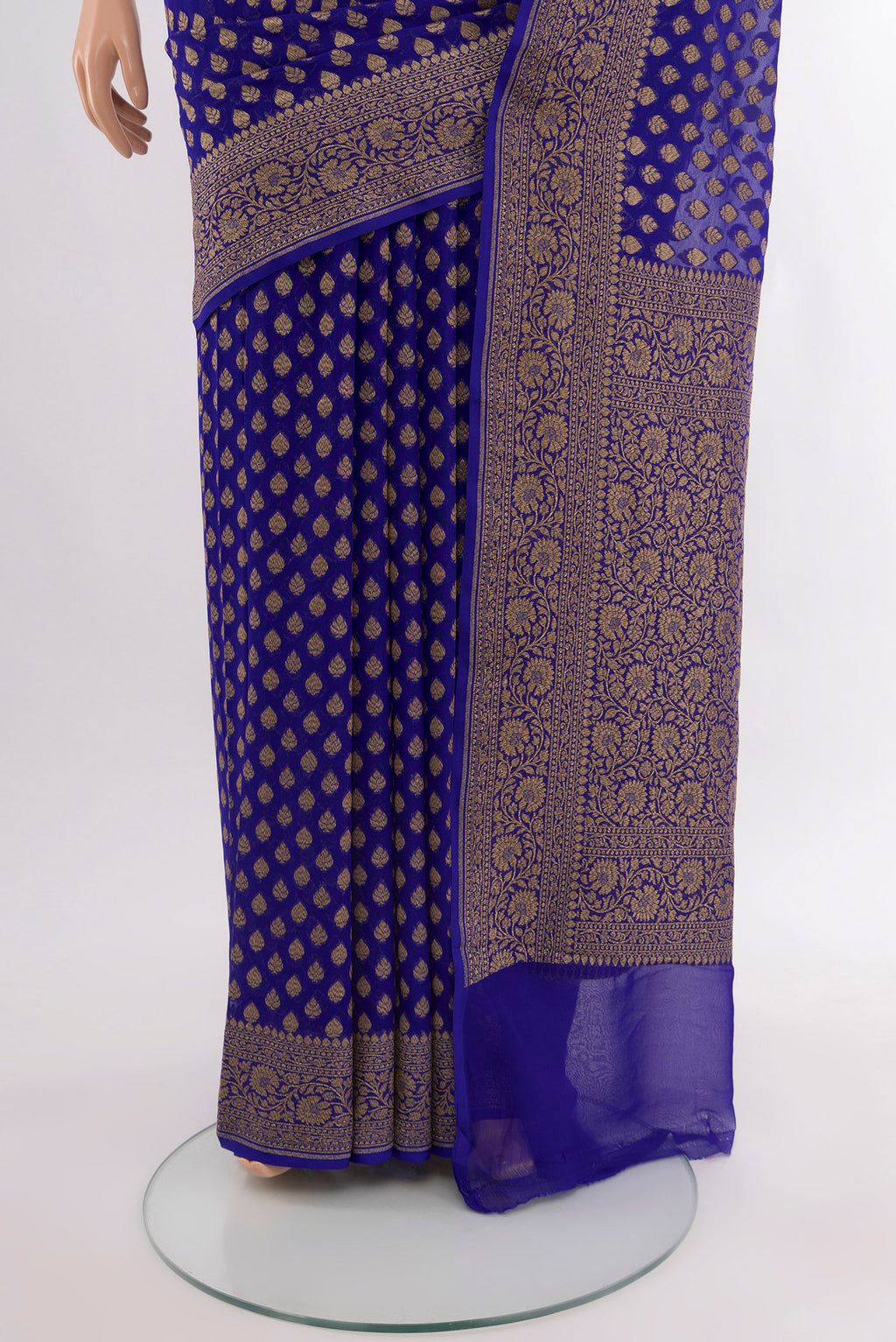 Pleats and pallu of Pure Silk Pure Zari Dark Blue Banarasi Georgette Saree with Zari Butta on the body and Silk Border. 