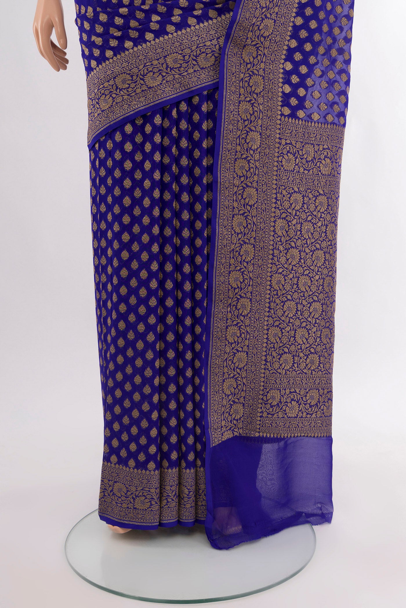Pleats and pallu of Pure Silk Pure Zari Dark Blue Banarasi Georgette Saree with Zari Butta on the body and Silk Border. 