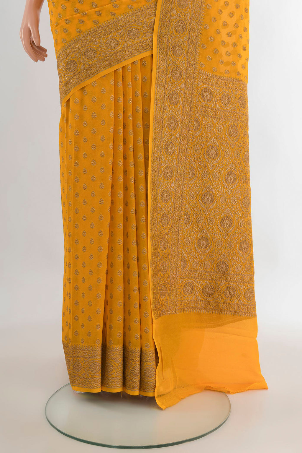 Pleats and pallu of Yellow Banarasi Georgette Saree with Zari Brocade on the body and Zari Border. 
