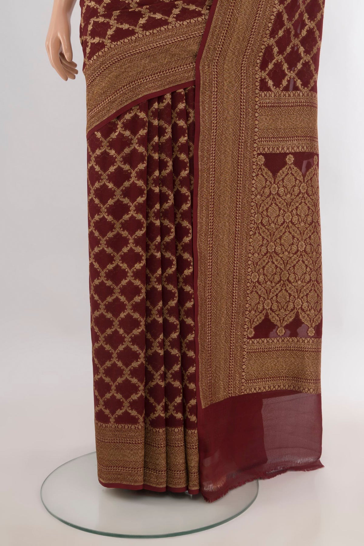 Pleats and pallu of Coffee Brown Banarasi Georgette Saree with Zari Brocade on the body and Zari Border. 