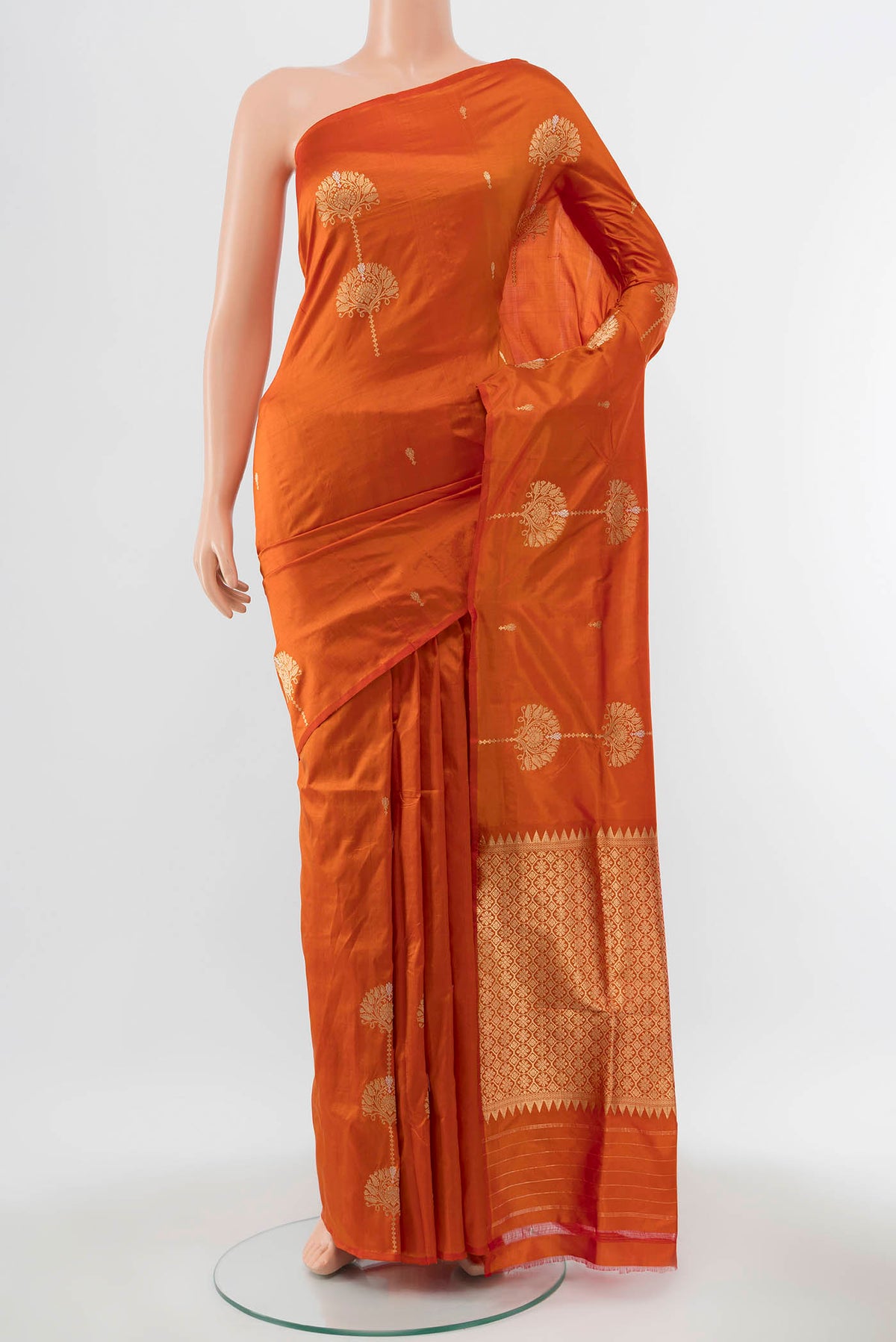 Orange Banarasi Katan Silk Saree with Zari Butta on the body and Without Border displayed on a mannequin