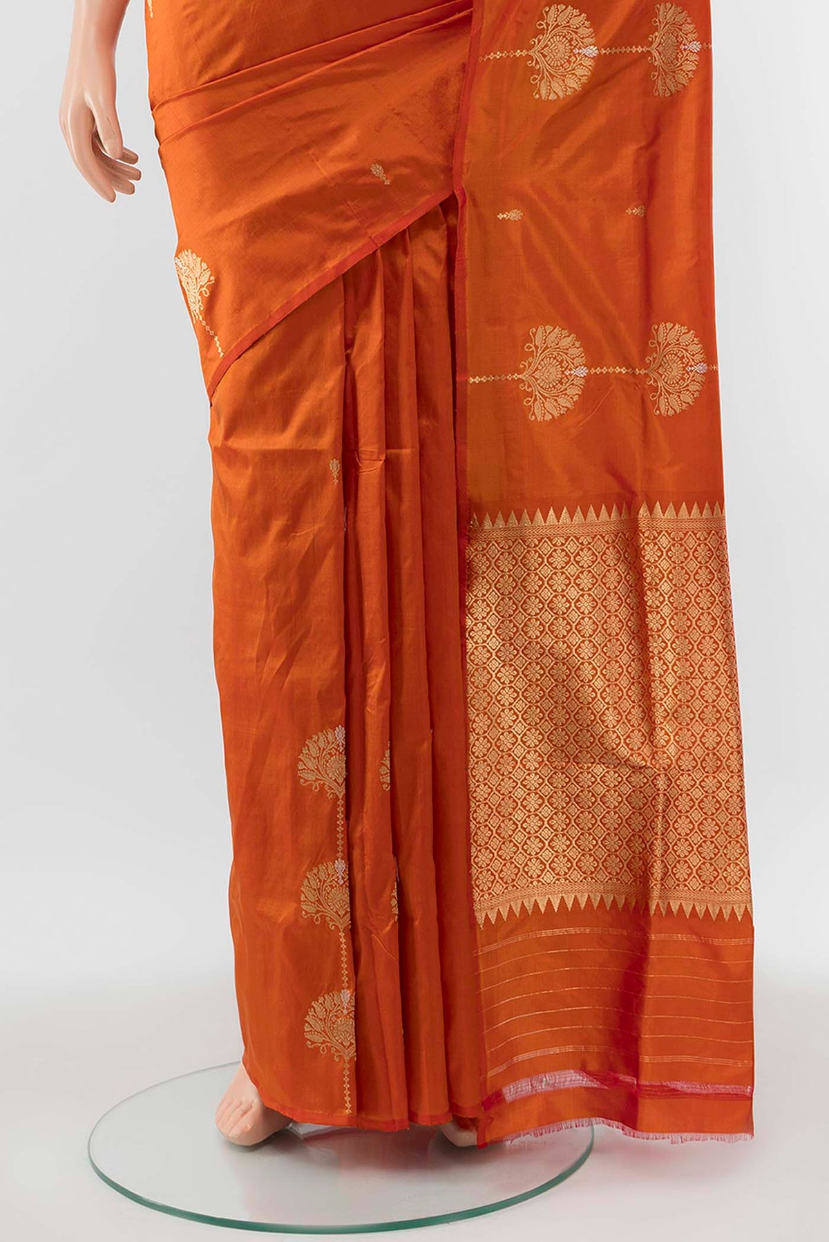 Pleats and pallu of Orange Banarasi Katan Silk Saree with Zari Butta on the body and Without Border