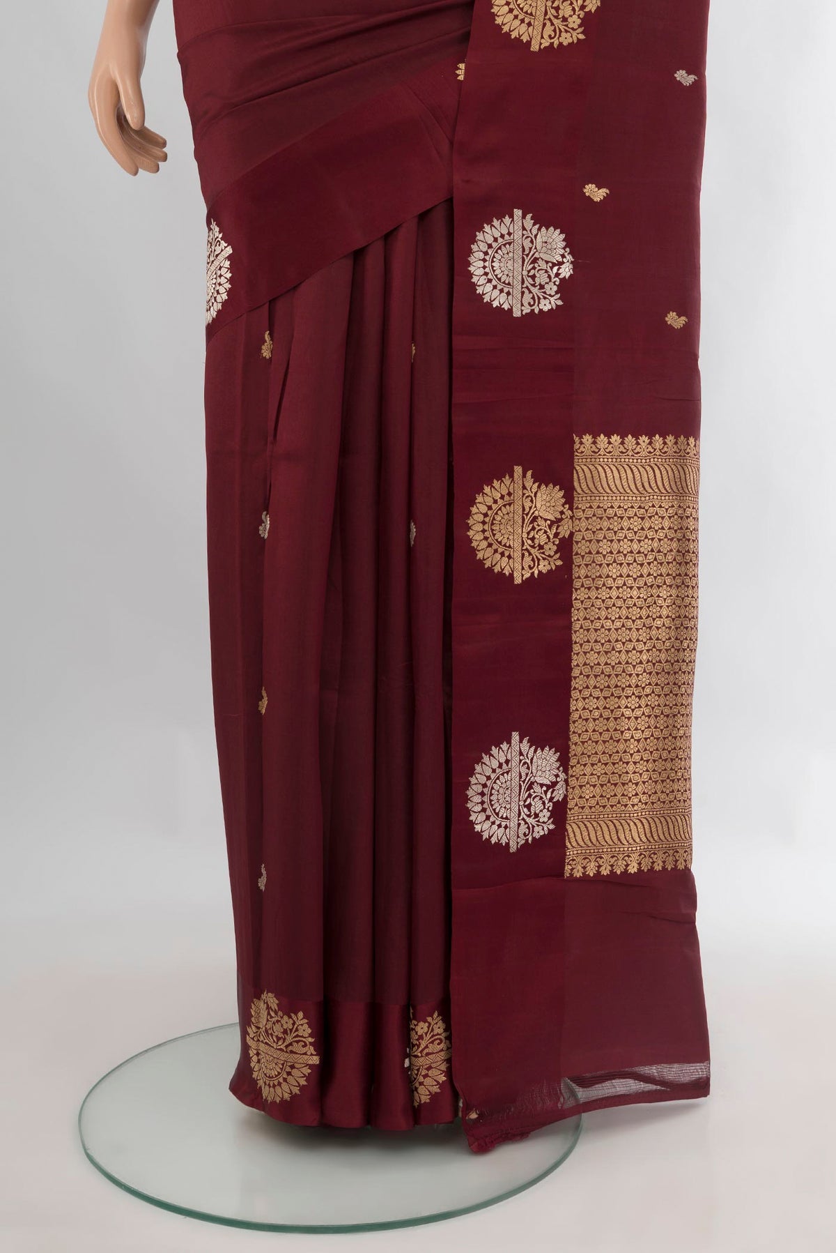 Pleats and pallu of Pure Silk Coffee Brown Banarasi Katan Saree with Zari Butta on the body and Fancy Border. 
