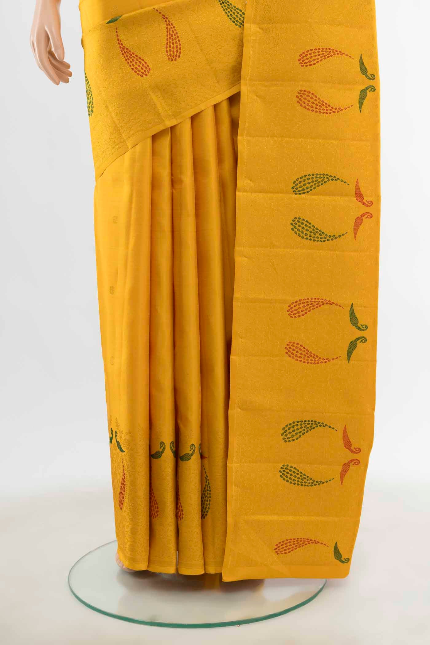 Pleats and pallu of Yellow Kanchipuram Silk Saree with Zari Butta on the body and Silk Border
