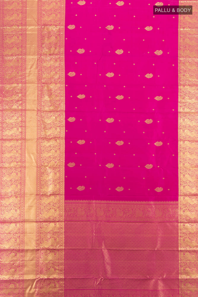Flat view of Pure Silk Pure Zari Magenta Kanjivaram Saree with Zari Butta on the body and Silk Border. 