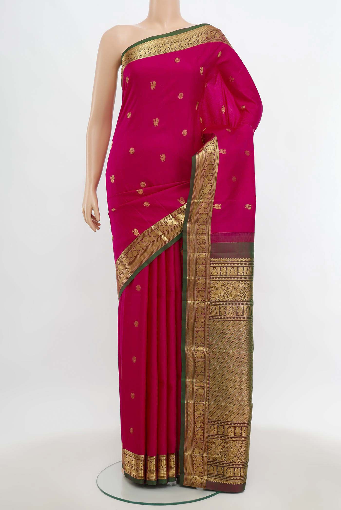 Magenta Kanchipuram Silk Saree with Zari Butta on the body and Silk Border.  displayed on a mannequin