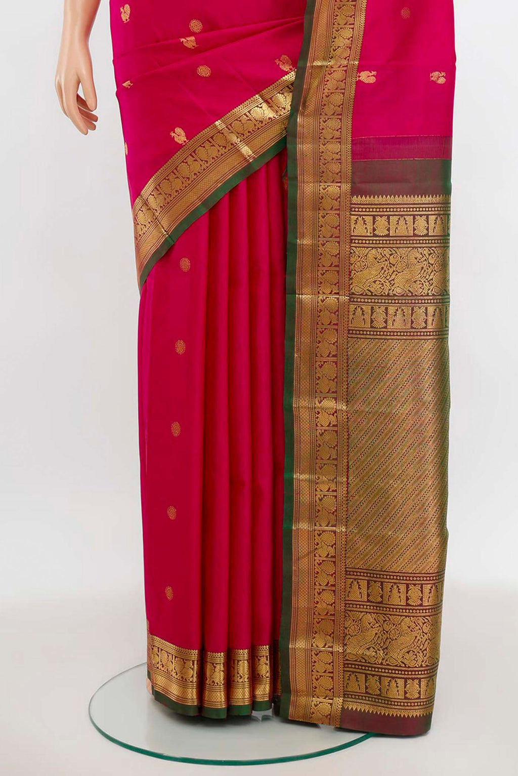 Pleats and pallu of Magenta Kanchipuram Silk Saree with Zari Butta on the body and Silk Border. 