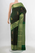 Bottle Green Kanjivaram Silk Saree with Zari Butta on the body and Silk Border.  displayed on a mannequin