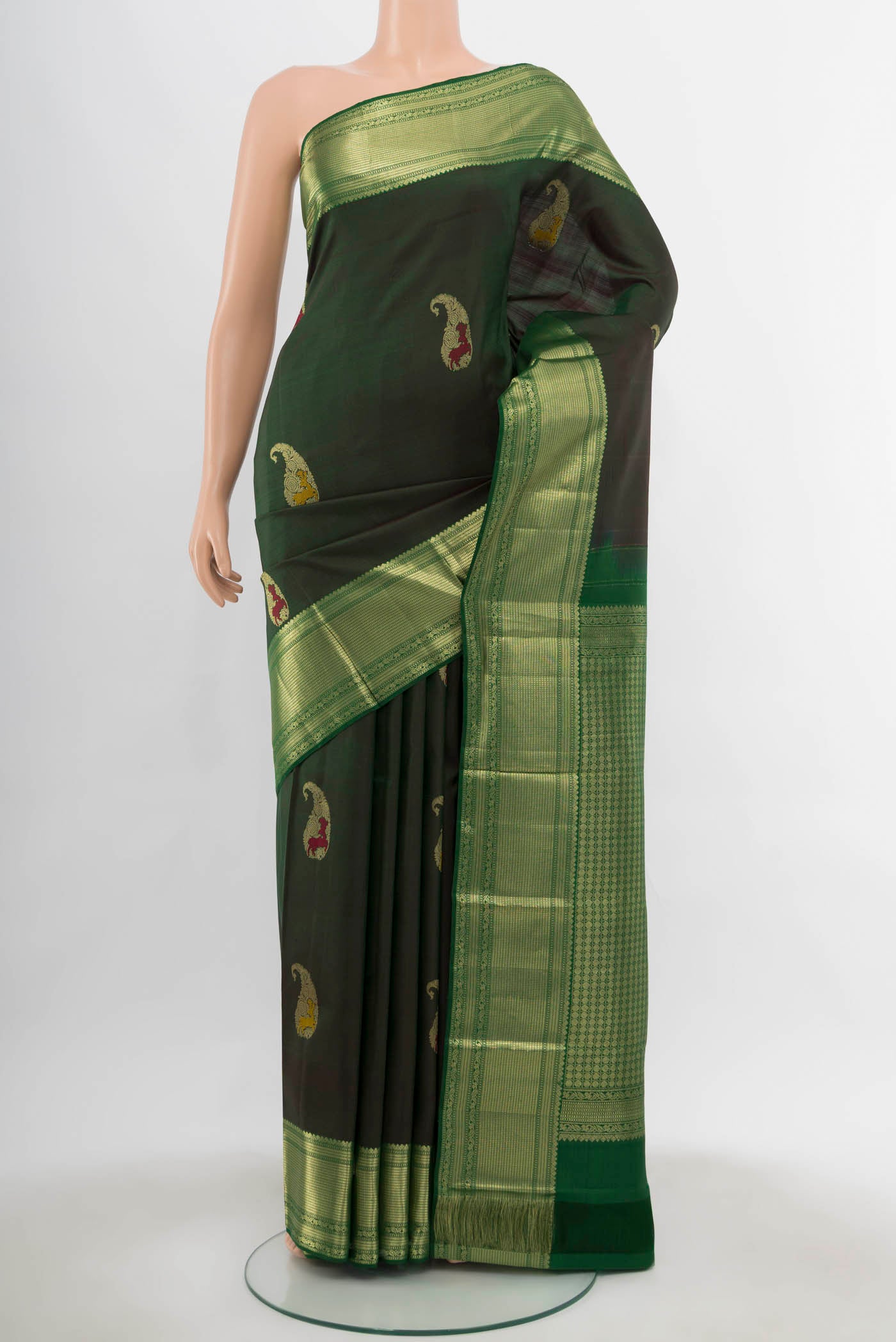 Bottle Green Kanjivaram Silk Saree with Zari Butta on the body and Silk Border.  displayed on a mannequin