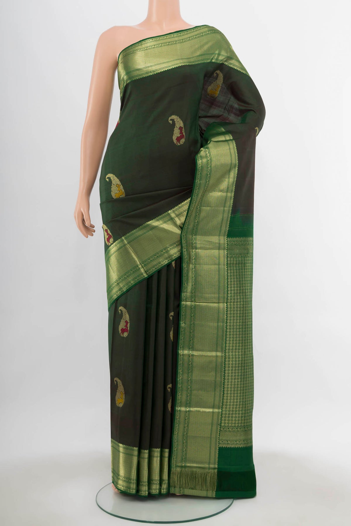Bottle Green Kanjivaram Silk Saree with Zari Butta on the body and Silk Border.  displayed on a mannequin