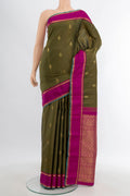 Mehandi Green Kanjivaram Silk Saree with Zari Butta on the body and Plain Border.  displayed on a mannequin