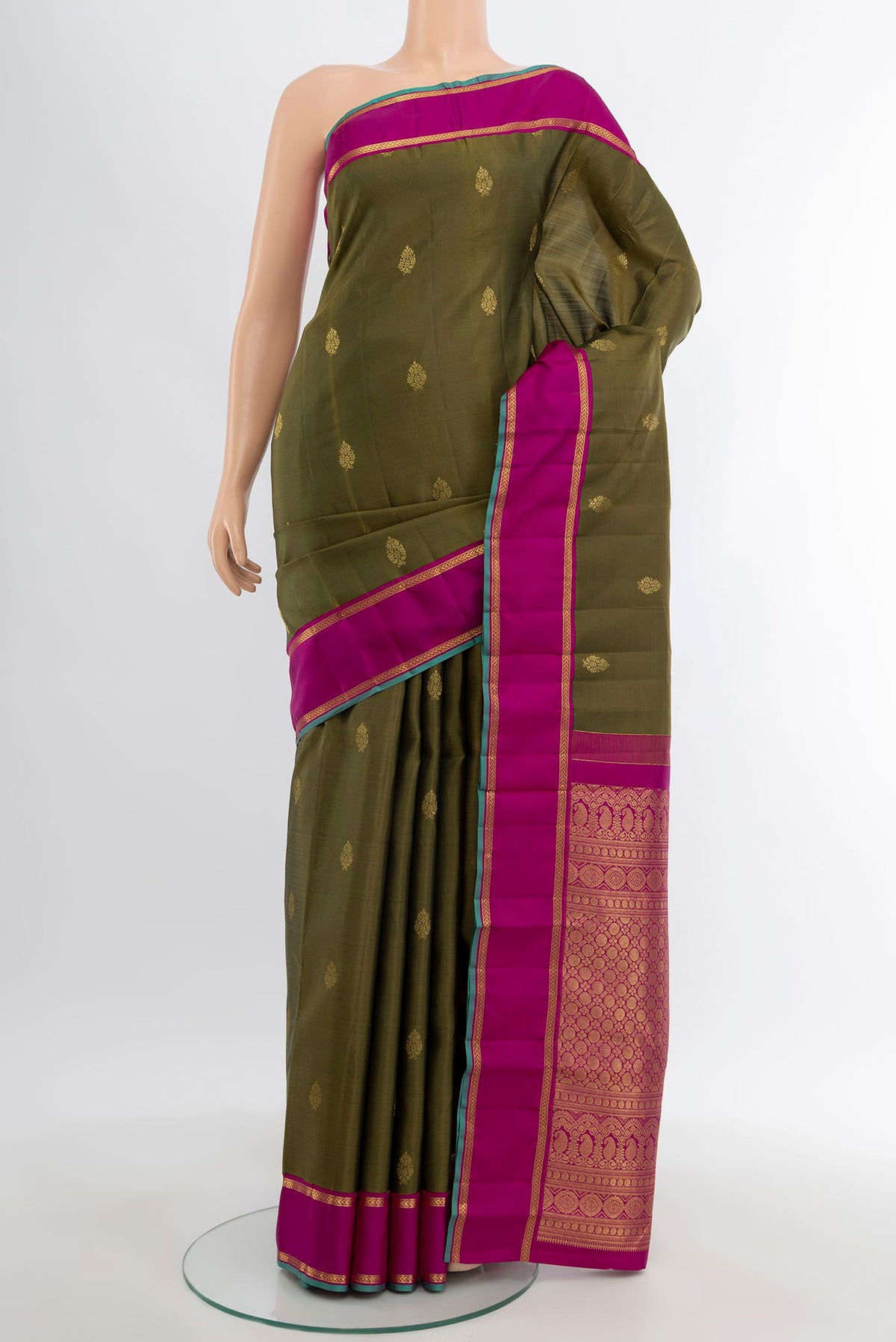 Mehandi Green Kanjivaram Silk Saree with Zari Butta on the body and Plain Border.  displayed on a mannequin