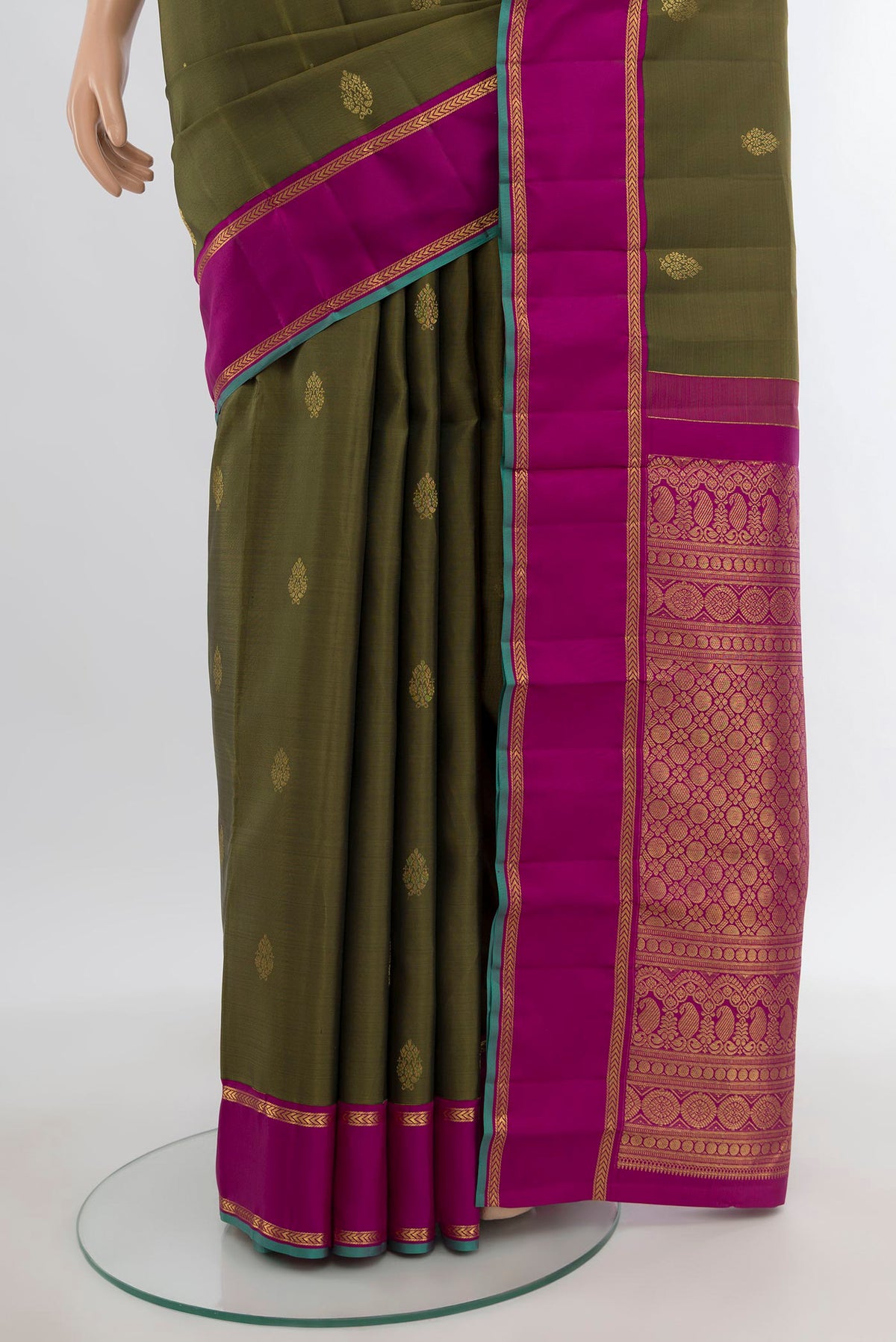Pleats and pallu of Mehandi Green Kanjivaram Silk Saree with Zari Butta on the body and Plain Border. 