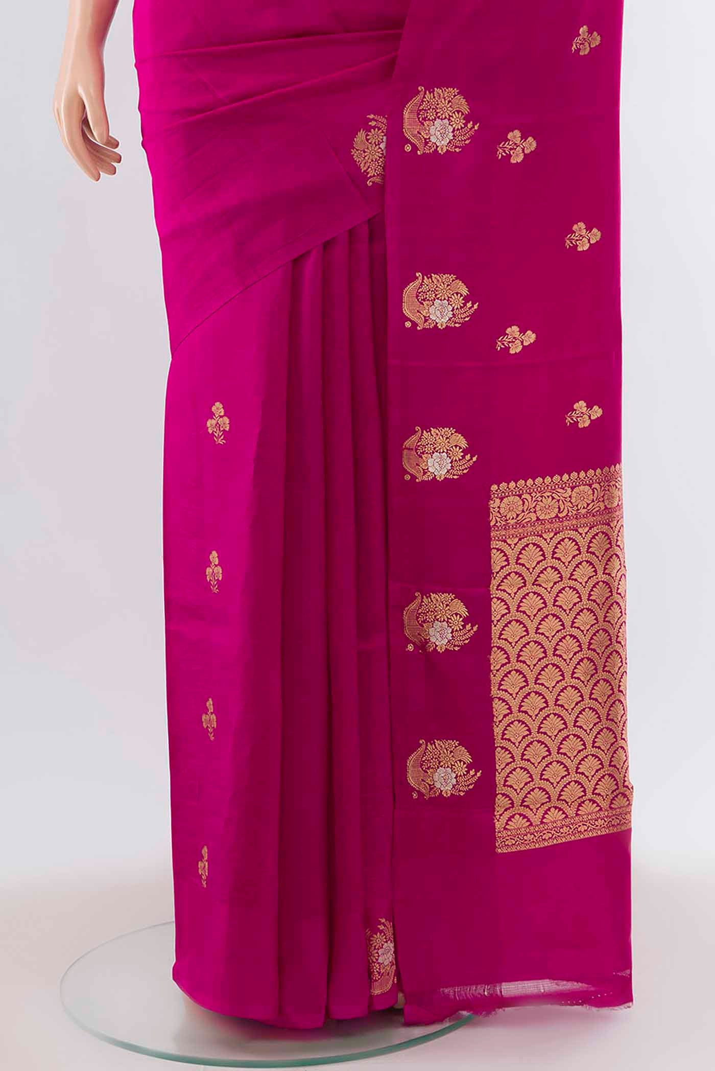Pleats and pallu of Magenta Banarasi Katan Silk Saree with Zari Butta on the body and Without Border