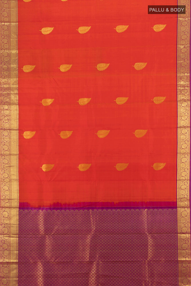 Flat view of Brick Orange Kanchipuram Silk Saree with Plain Body and Silk Border. 