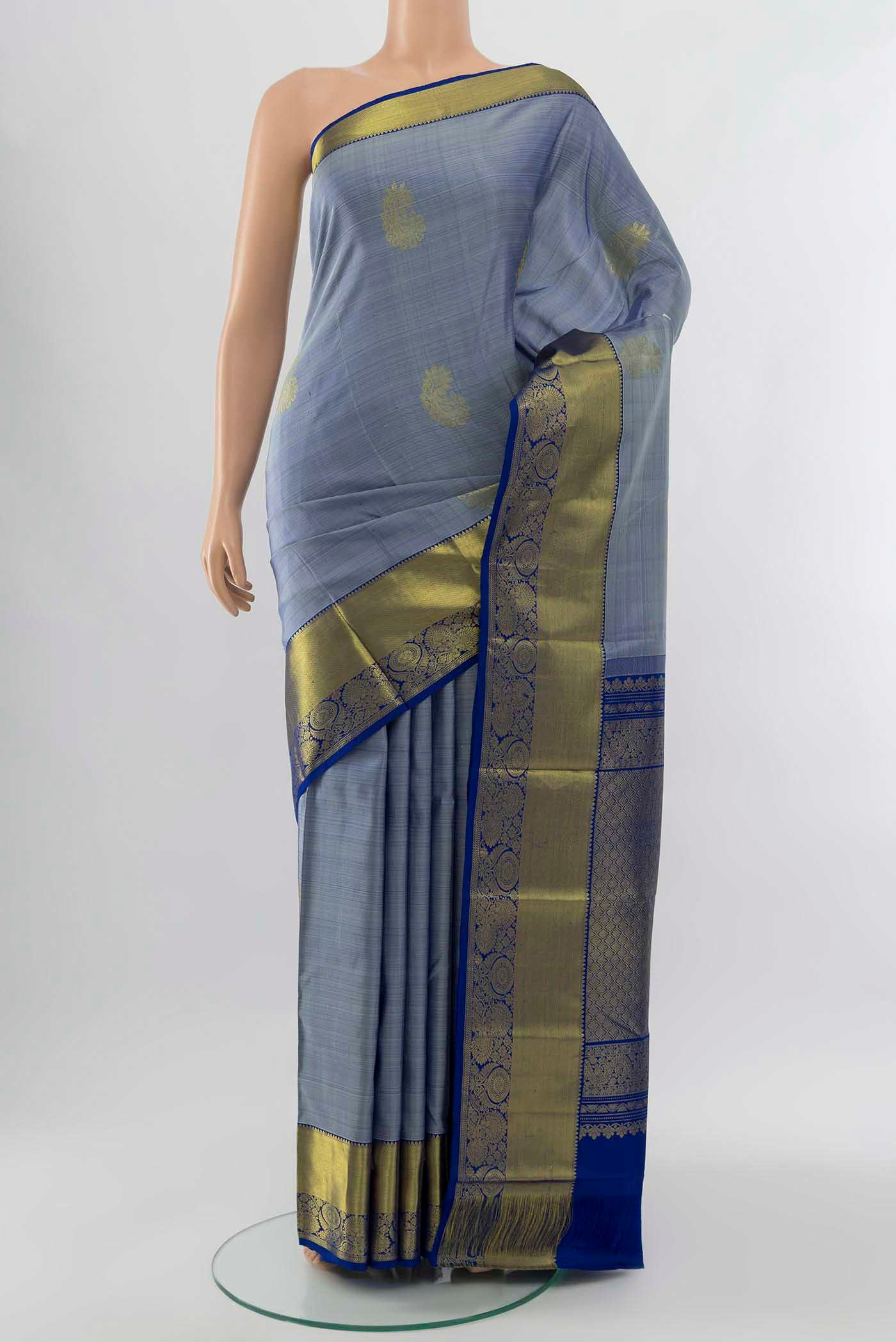 Light Blue Kanchipuram Silk Saree with Zari Brocade on the body and Silk Border displayed on a mannequin
