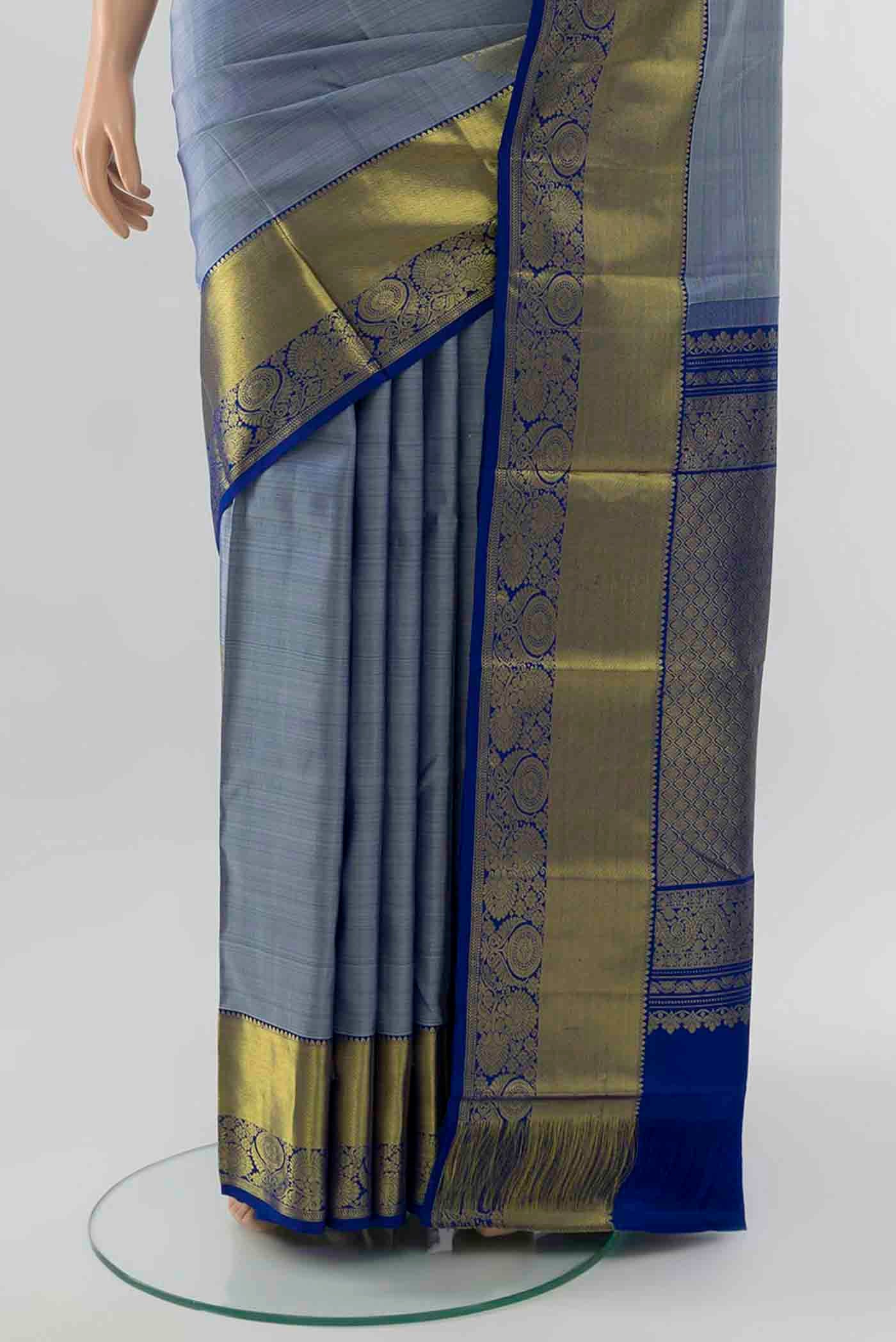 Pleats and pallu of Light Blue Kanchipuram Silk Saree with Zari Brocade on the body and Silk Border