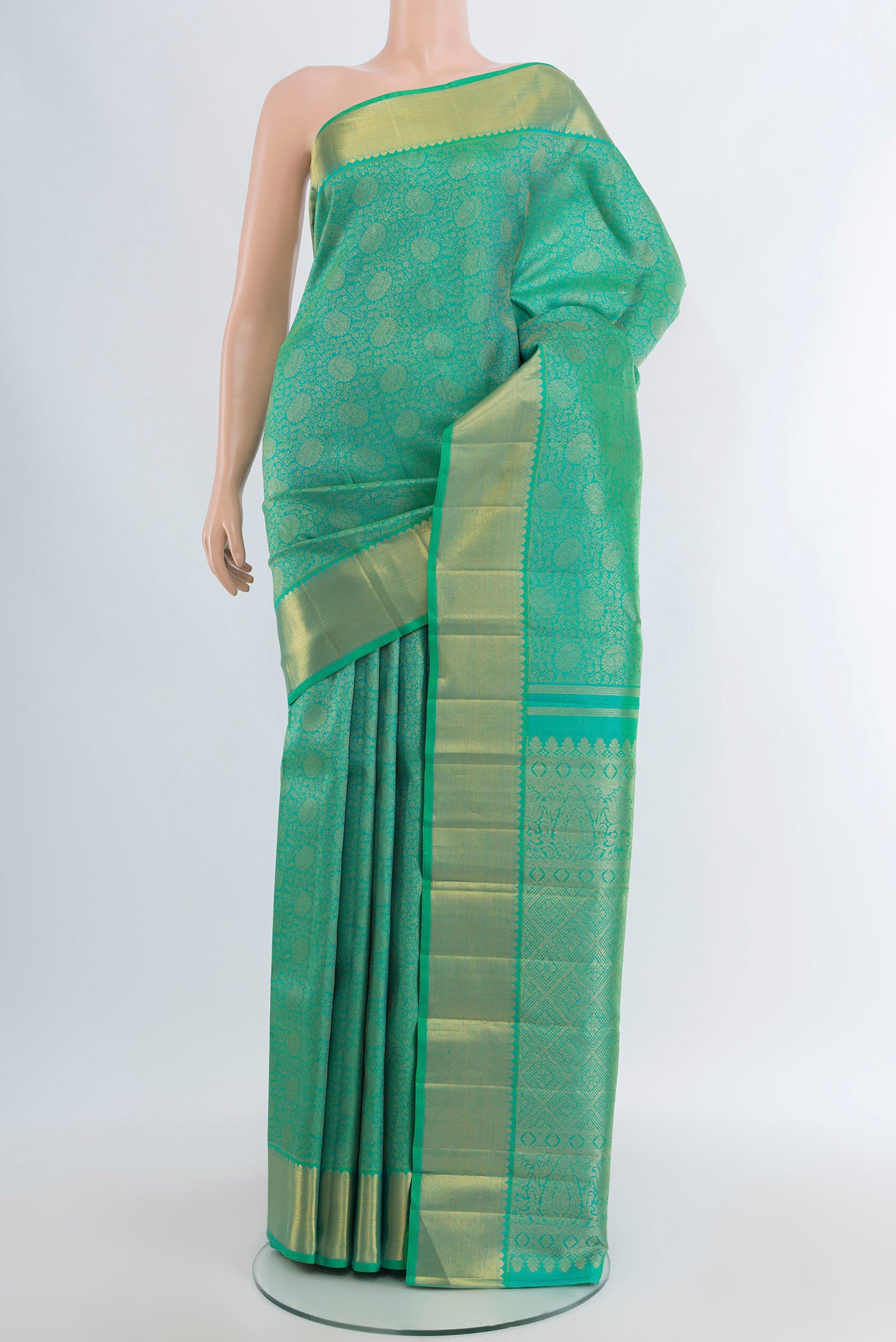 Pure Silk Pure Zari Sea Green Kanjivaram Saree with Zari Brocade on the body and Zari Border.  displayed on a mannequin