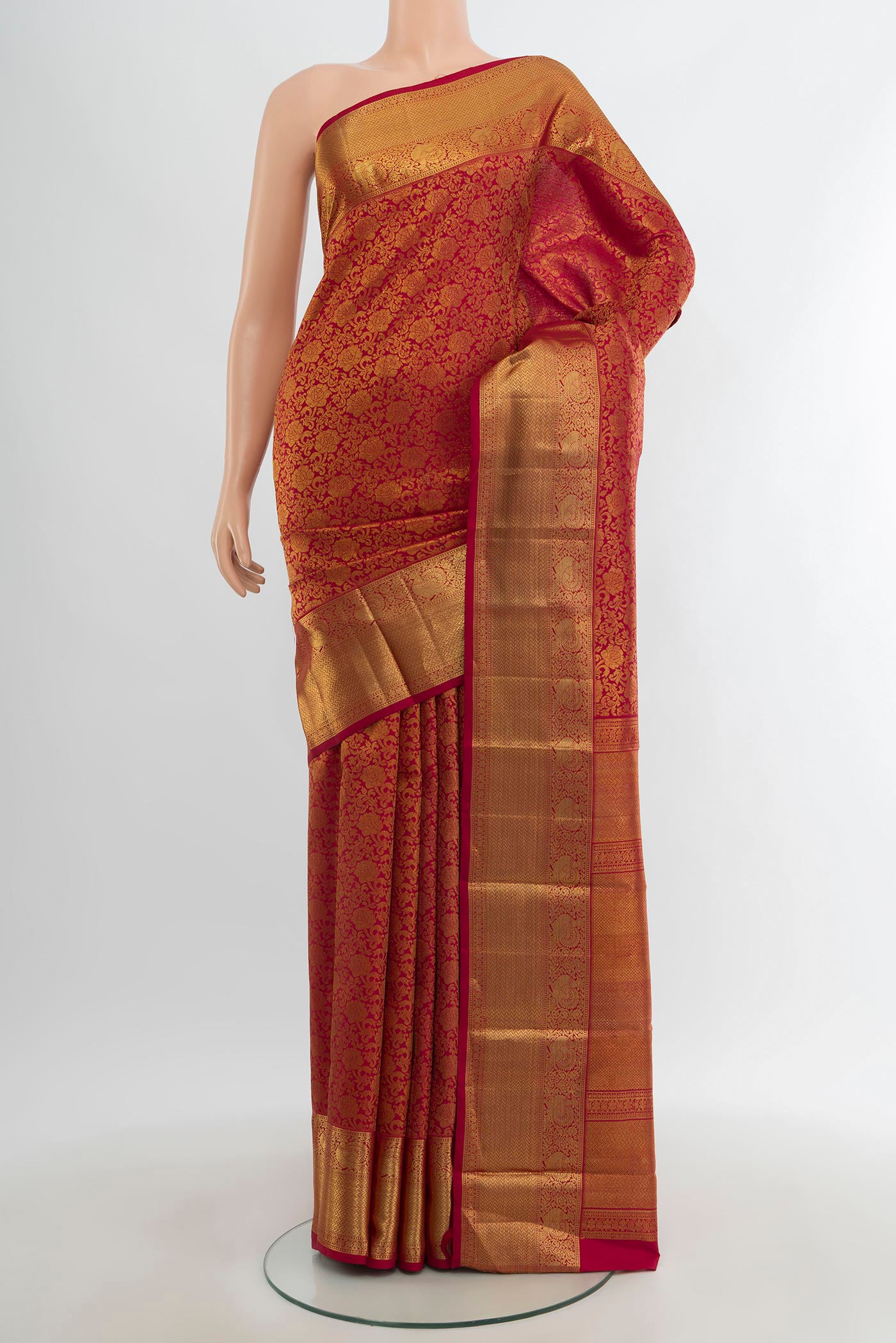 Maroon Kanchipuram Silk Saree with Zari Brocade on the body and Zari Border.  displayed on a mannequin