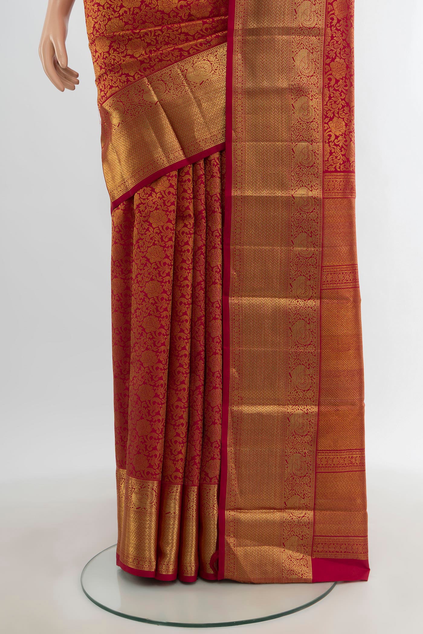 Pleats and pallu of Maroon Kanchipuram Silk Saree with Zari Brocade on the body and Zari Border. 