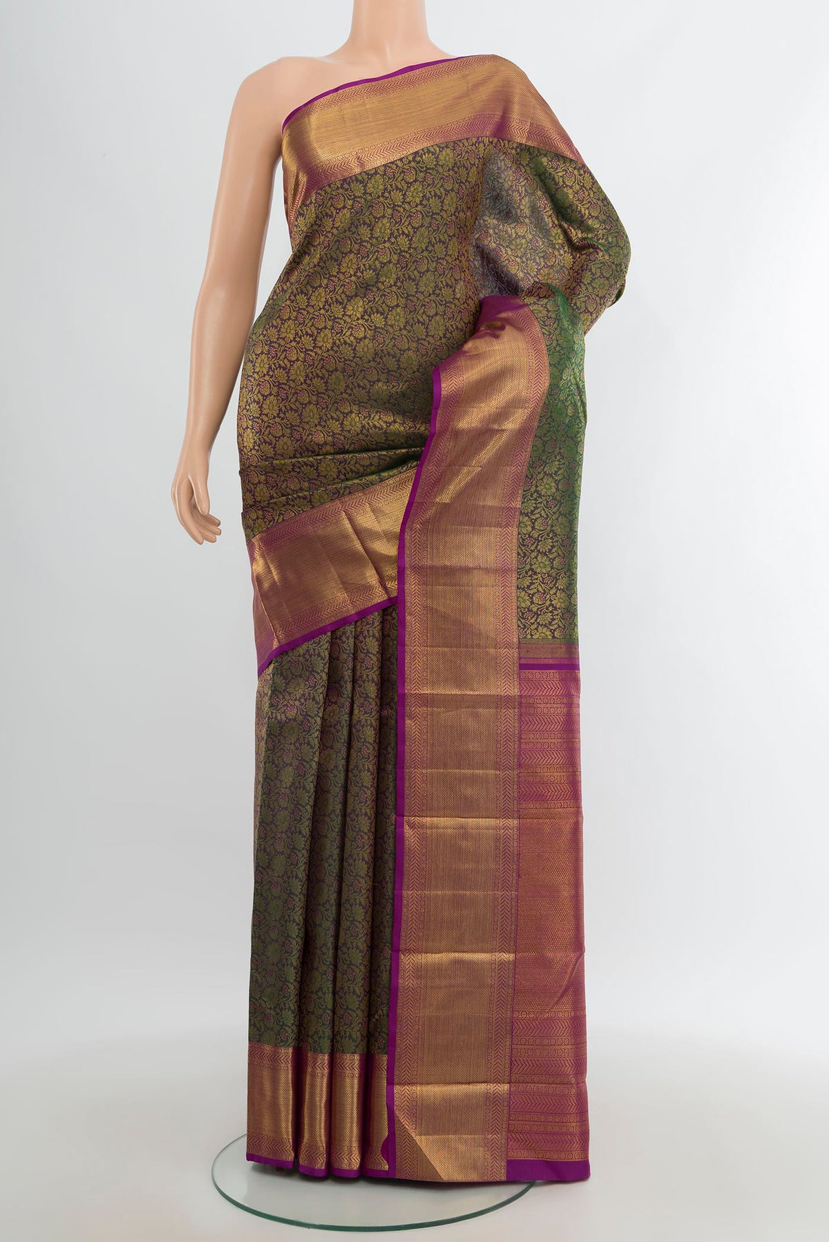 Green with Purple Color Kanchipuram Silk Saree with Zari Brocade on the body and Zari Border.  displayed on a mannequin