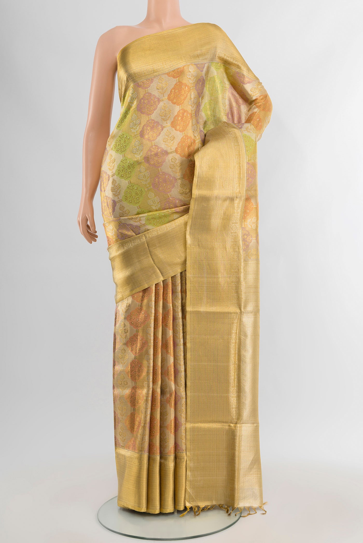 Golden Kanjivaram Tissue Silk Saree with Zari Brocade on the body and Zari Border.  displayed on a mannequin