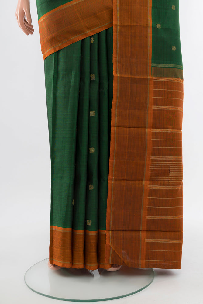 Pleats and pallu of Pure Silk Pure Zari Mint Green Kanjivaram Saree with Zari Butta on the body and Silk Border. 