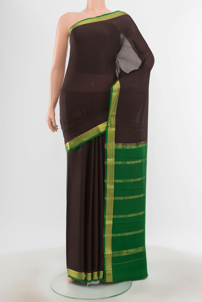 Black Mysore Crepe Saree with Zari Butta on the body and Silk Border.  displayed on a mannequin
