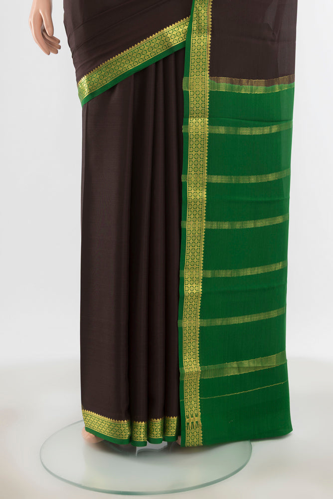 Pleats and pallu of Black Mysore Crepe Saree with Zari Butta on the body and Silk Border. 
