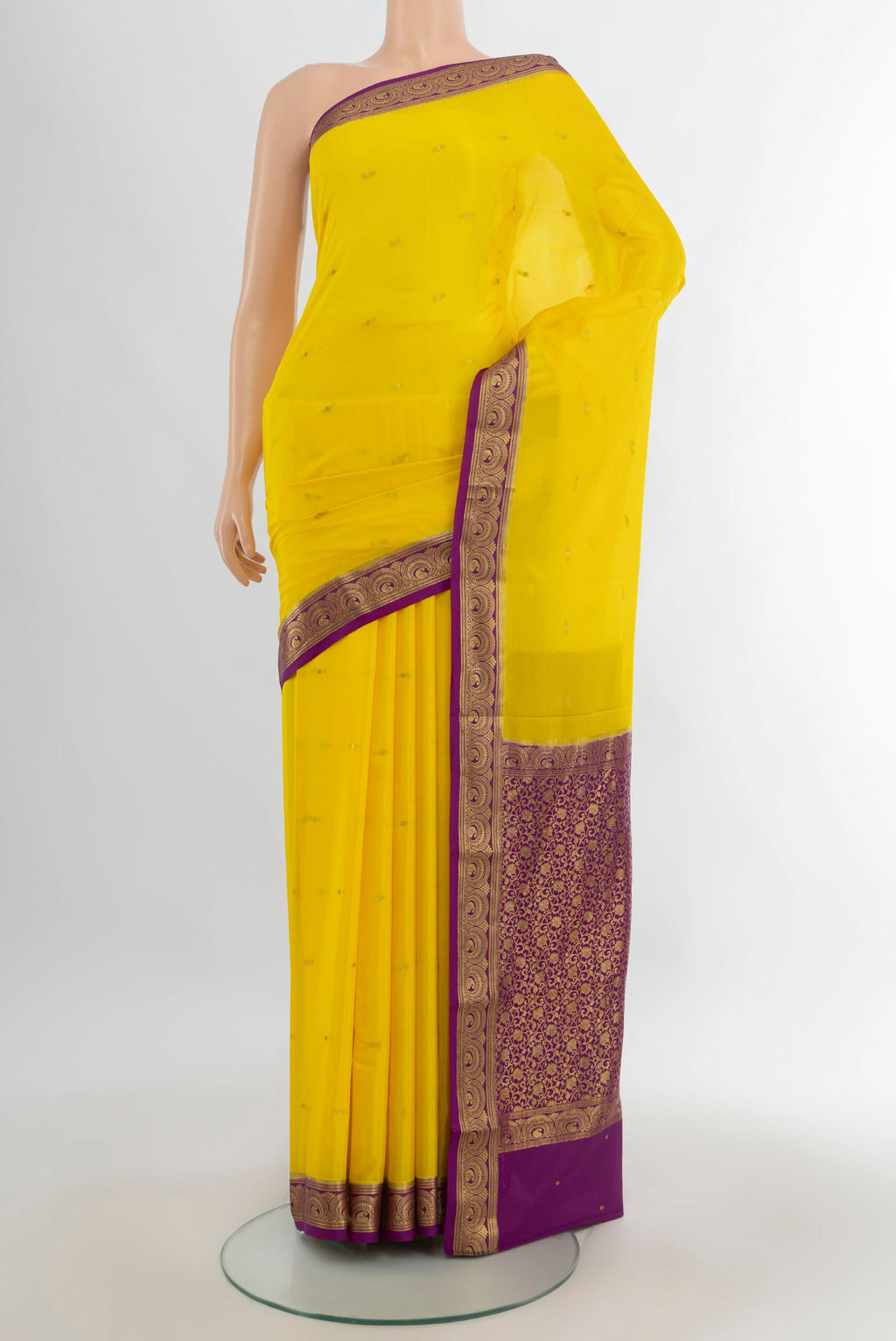 Yellow Mysore Crepe Saree with Zari Butta on the body and Zari Border.  displayed on a mannequin