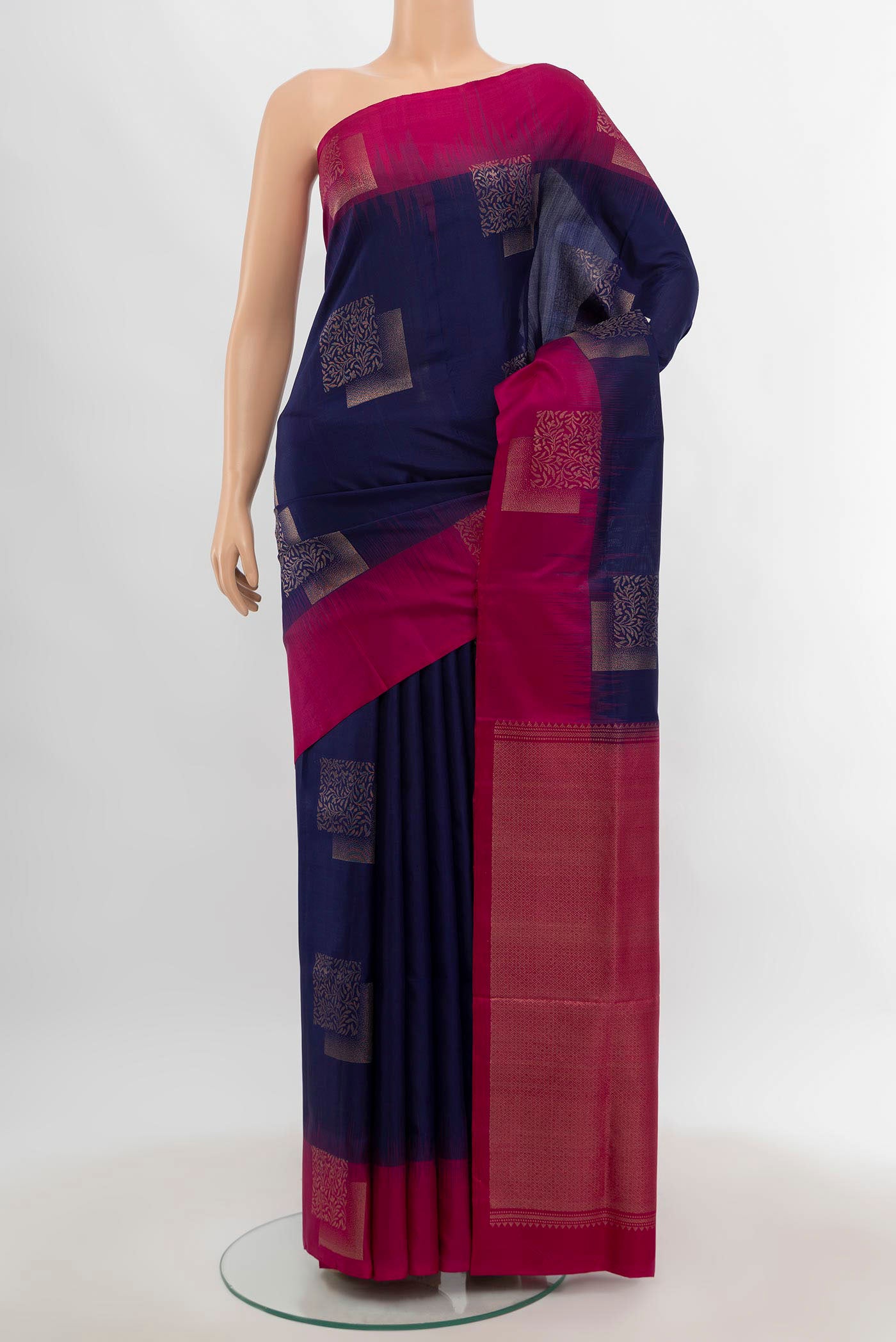 Navy Blue Soft Silk Saree with Zari Butta on the body and Fancy Border.  displayed on a mannequin