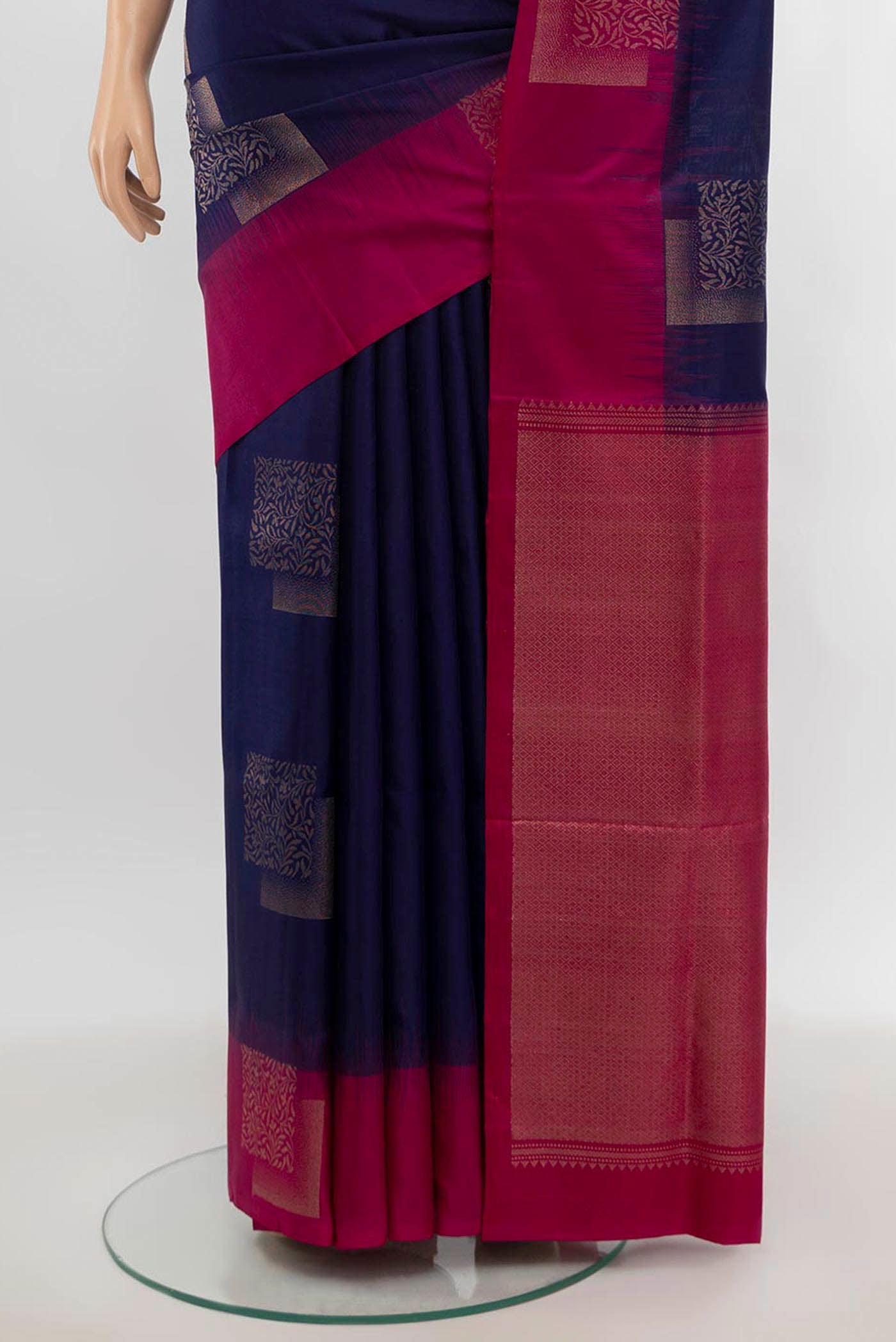 Pleats and pallu of Navy Blue Soft Silk Saree with Zari Butta on the body and Fancy Border. 