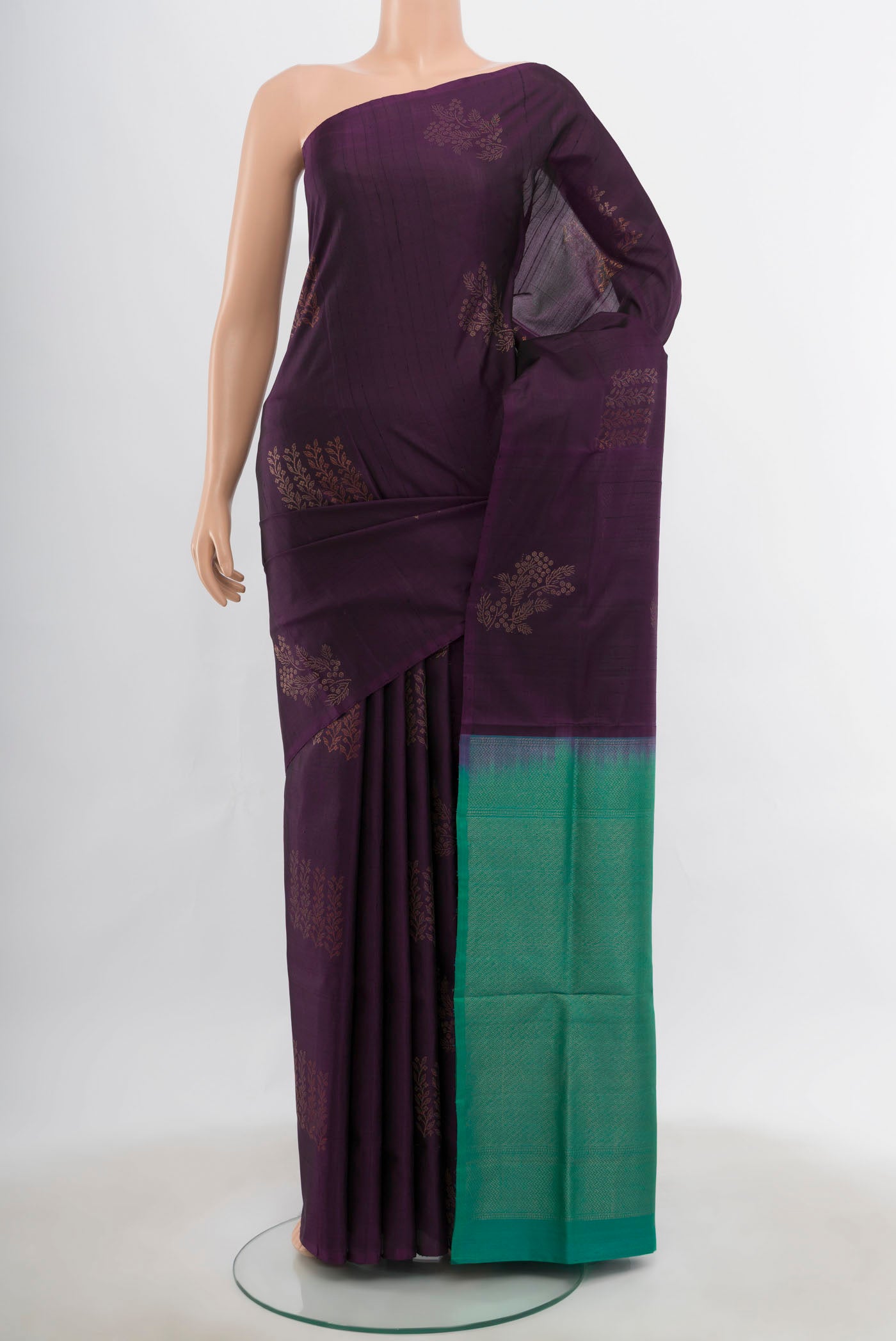 Violet Soft Silk Saree with Zari Butta on the body and Silk Border.  displayed on a mannequin