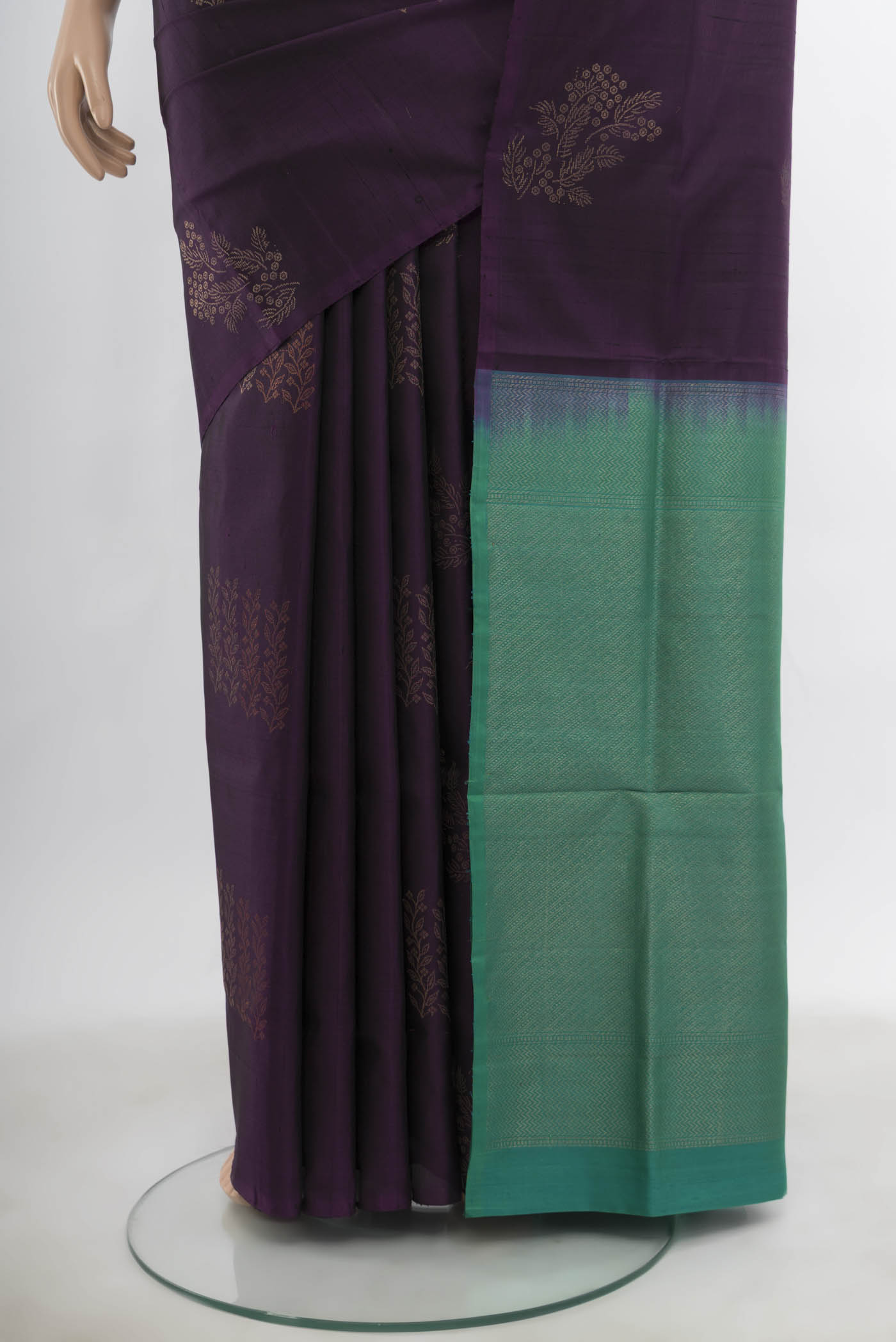 Pleats and pallu of Violet Soft Silk Saree with Zari Butta on the body and Silk Border. 