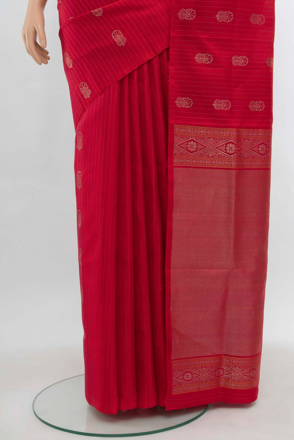 Pleats and pallu of Imperial Red Soft Silk Saree with Zari Butta on the body and Silk Border. 
