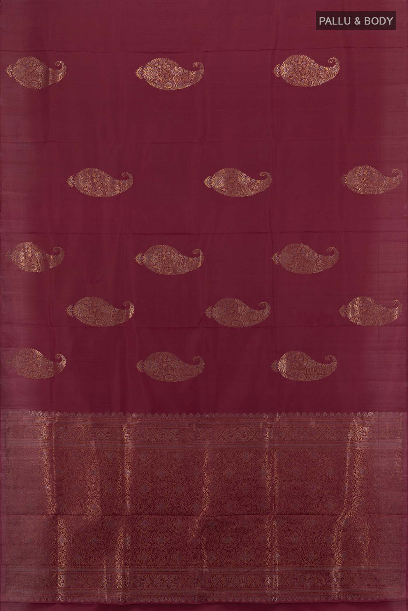 Flat view of Maroon Soft Silk Saree with Zari Butta on the body and Silk Border. 