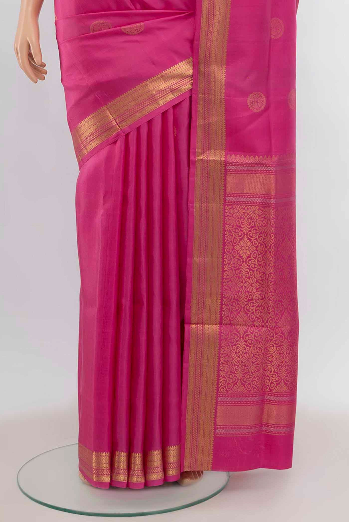 Pleats and pallu of Rose pink Soft Silk Saree with Zari Butta on the body and Zari Border