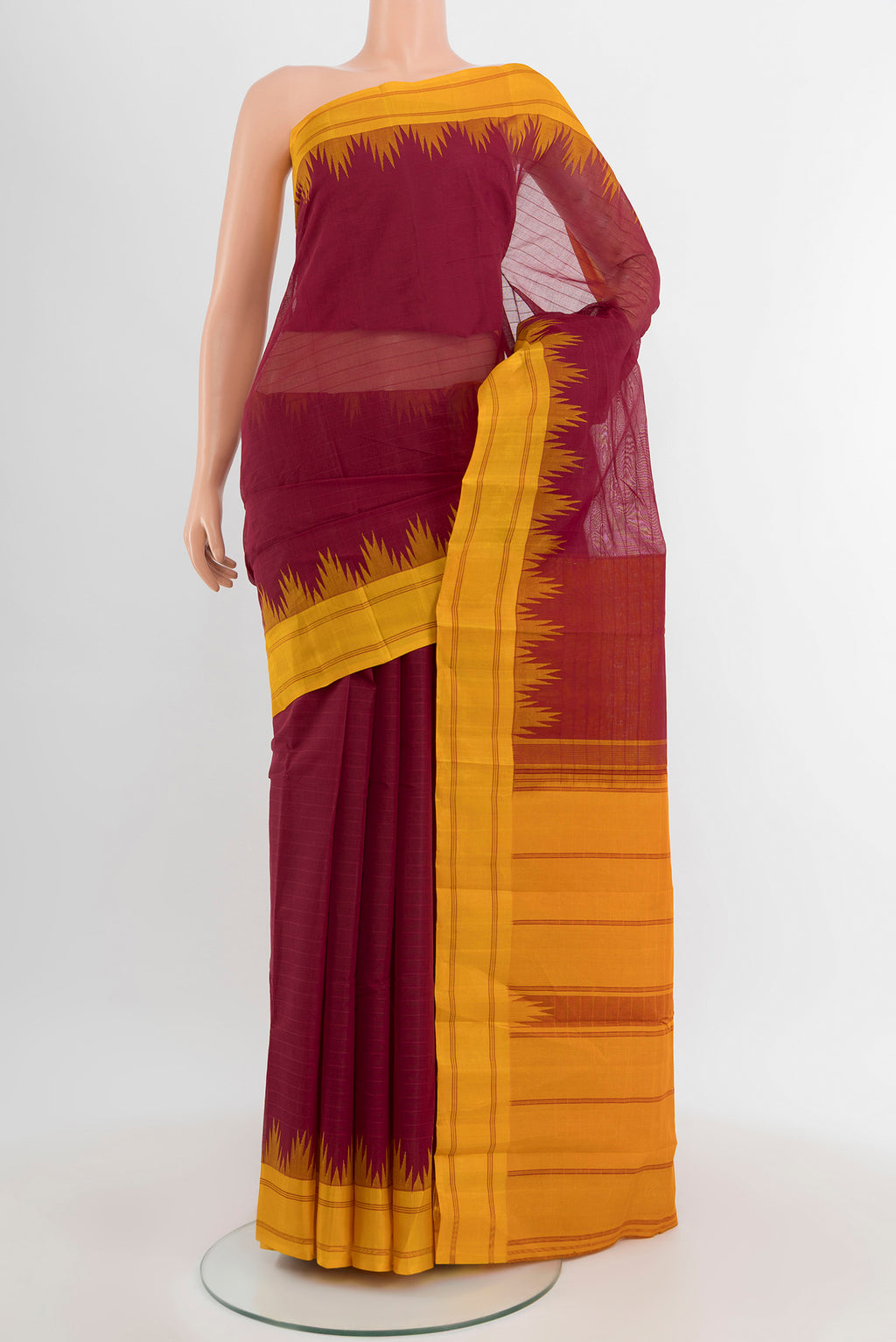 Maroon Kanchi Cotton Saree with Plain Body and Silk Border.  displayed on a mannequin