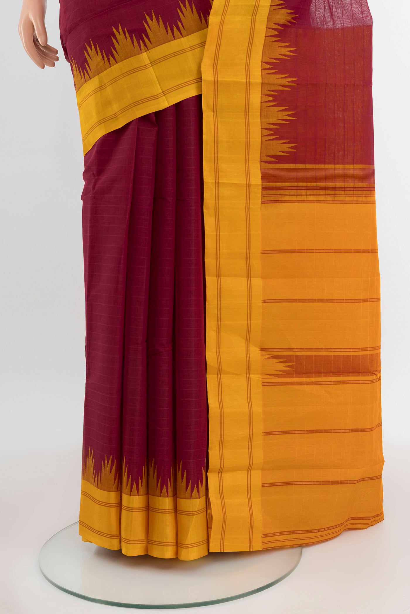 Pleats and pallu of Maroon Kanchi Cotton Saree with Plain Body and Silk Border. 