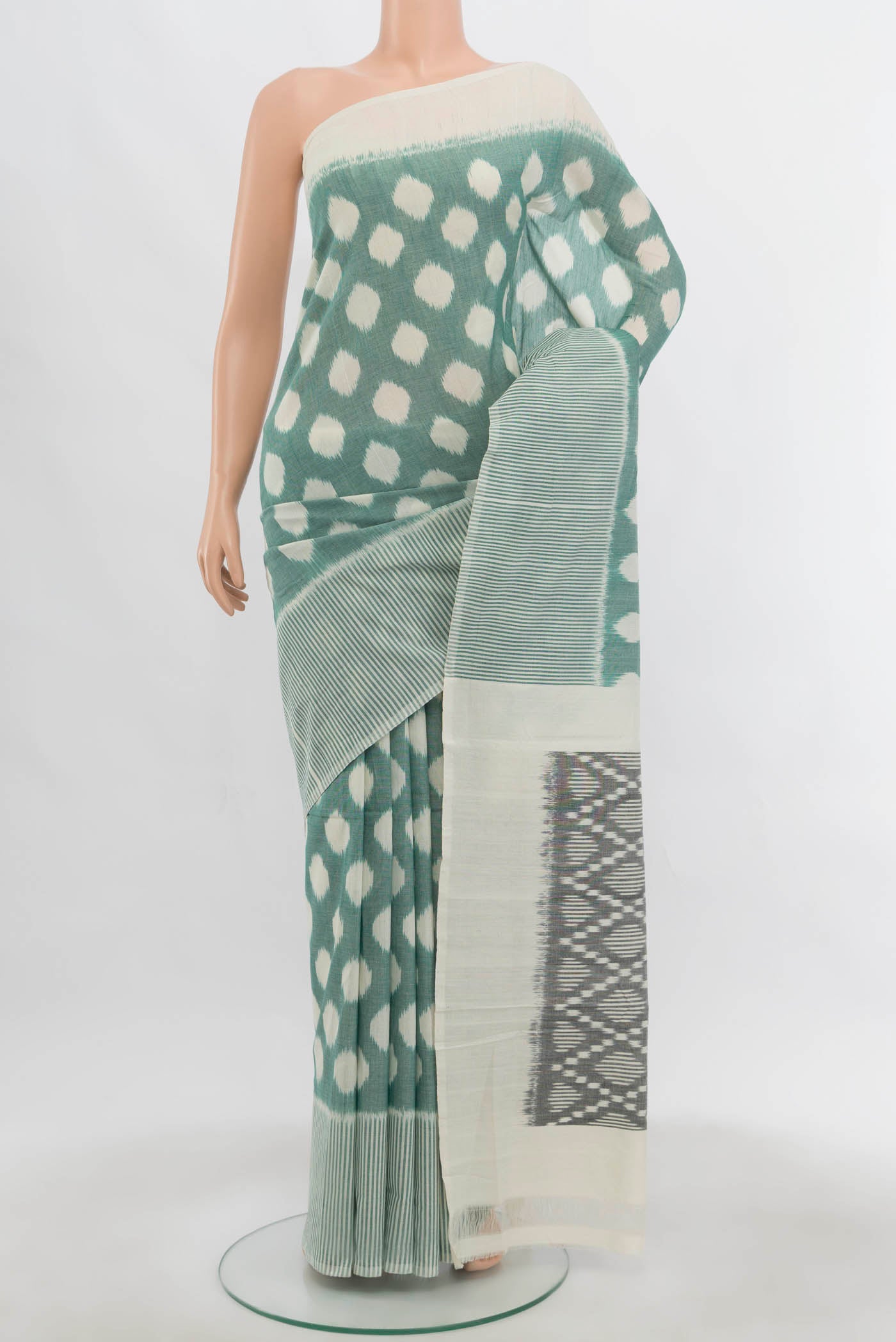 Cream Pochampally Cotton Saree with Ikat Print on the body and Ikat Border.  displayed on a mannequin