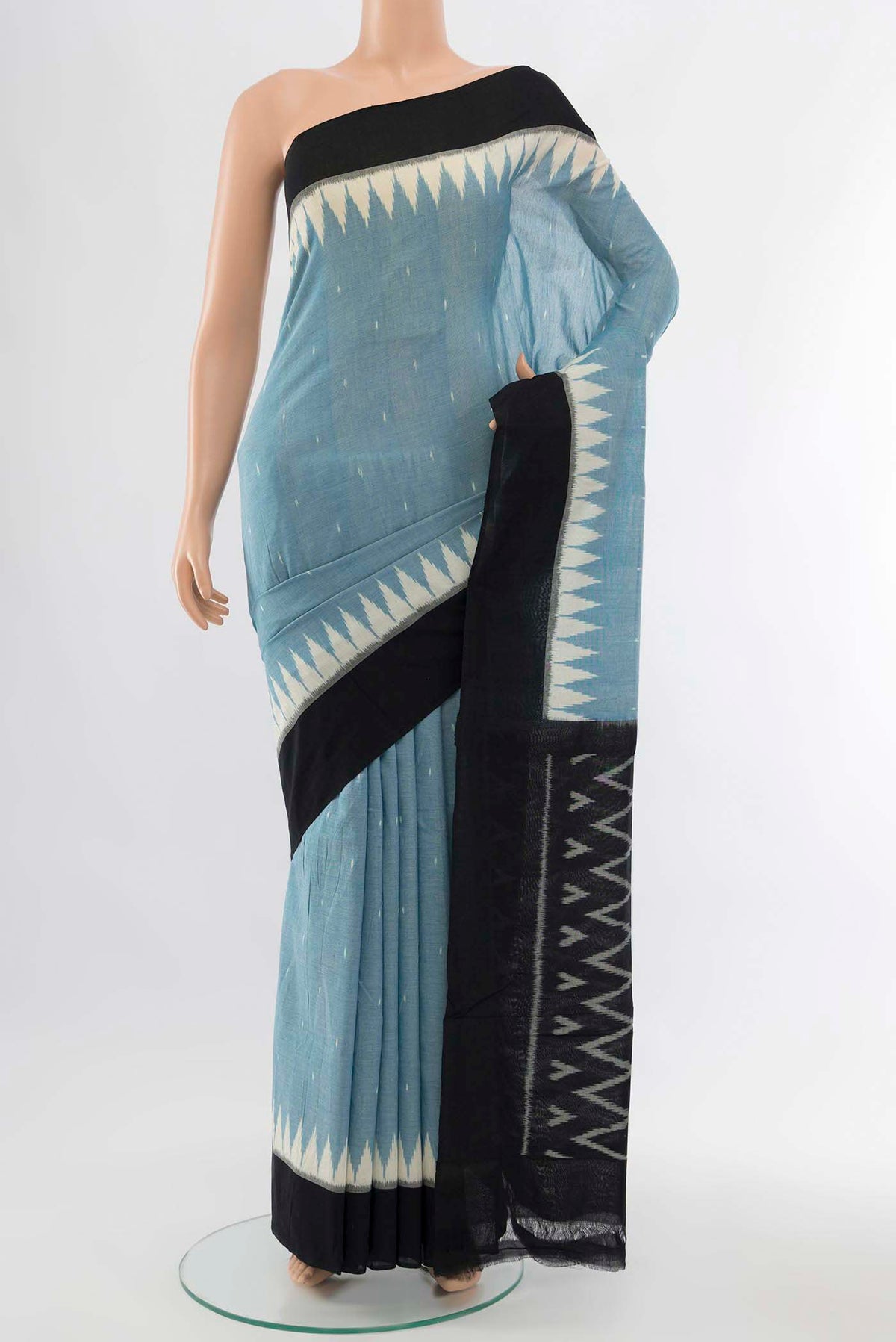 Light Blue Pochampally Cotton Saree with Ikat Print on the body and Ikat Border displayed on a mannequin