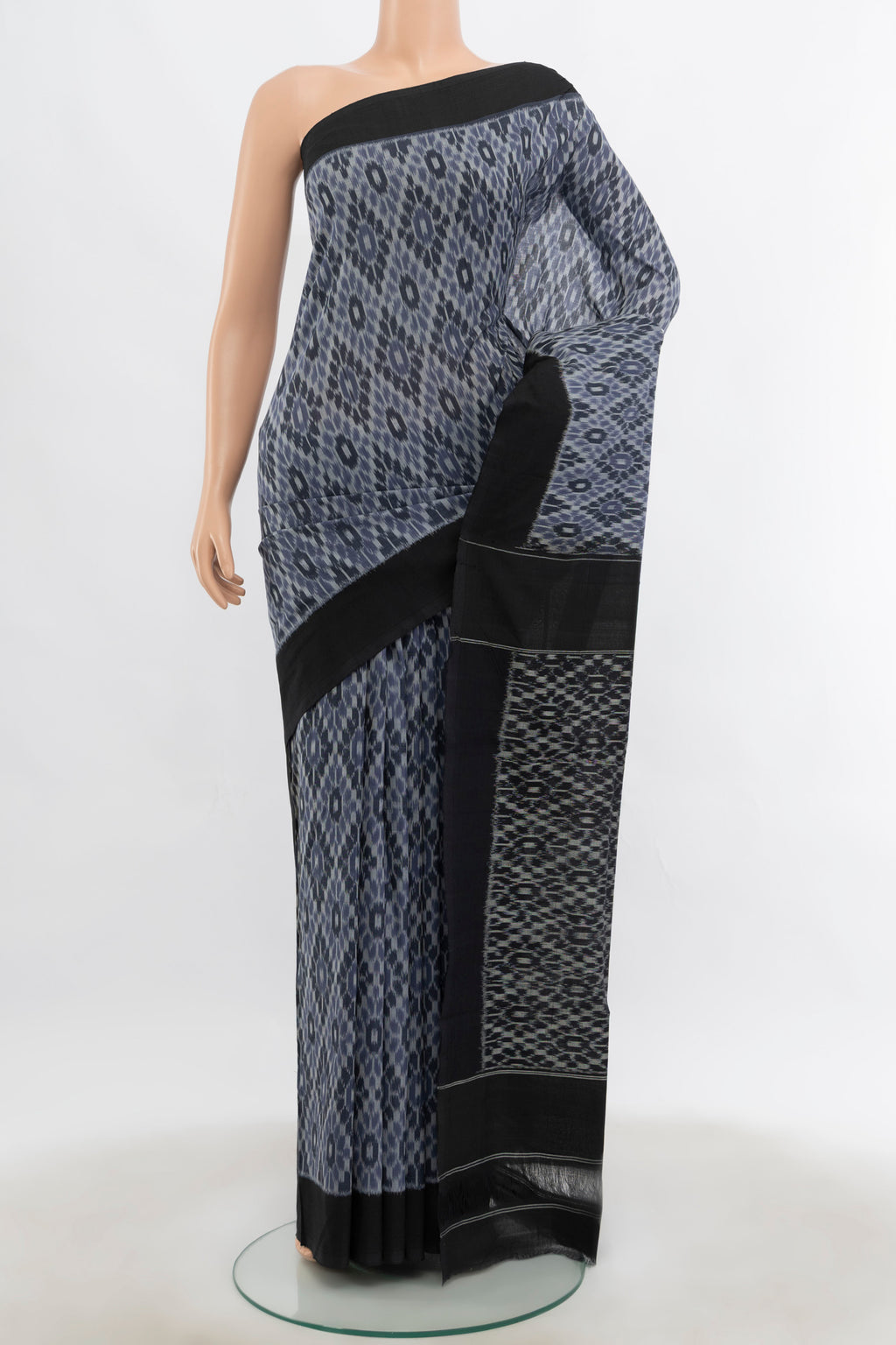 Multi Color Pochampally Cotton Saree with Ikat Print on the body and Silk Border.  displayed on a mannequin