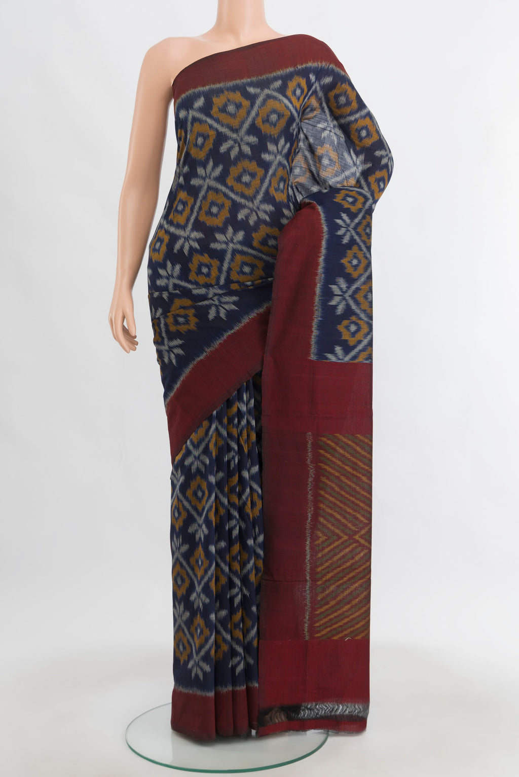 Navy Blue Pochampally Cotton Saree with Ikat Print on the body and Ikat Border.  displayed on a mannequin