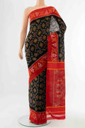 Black Pochampally Cotton Saree with Ikat Print on the body and Ikat Border displayed on a mannequin