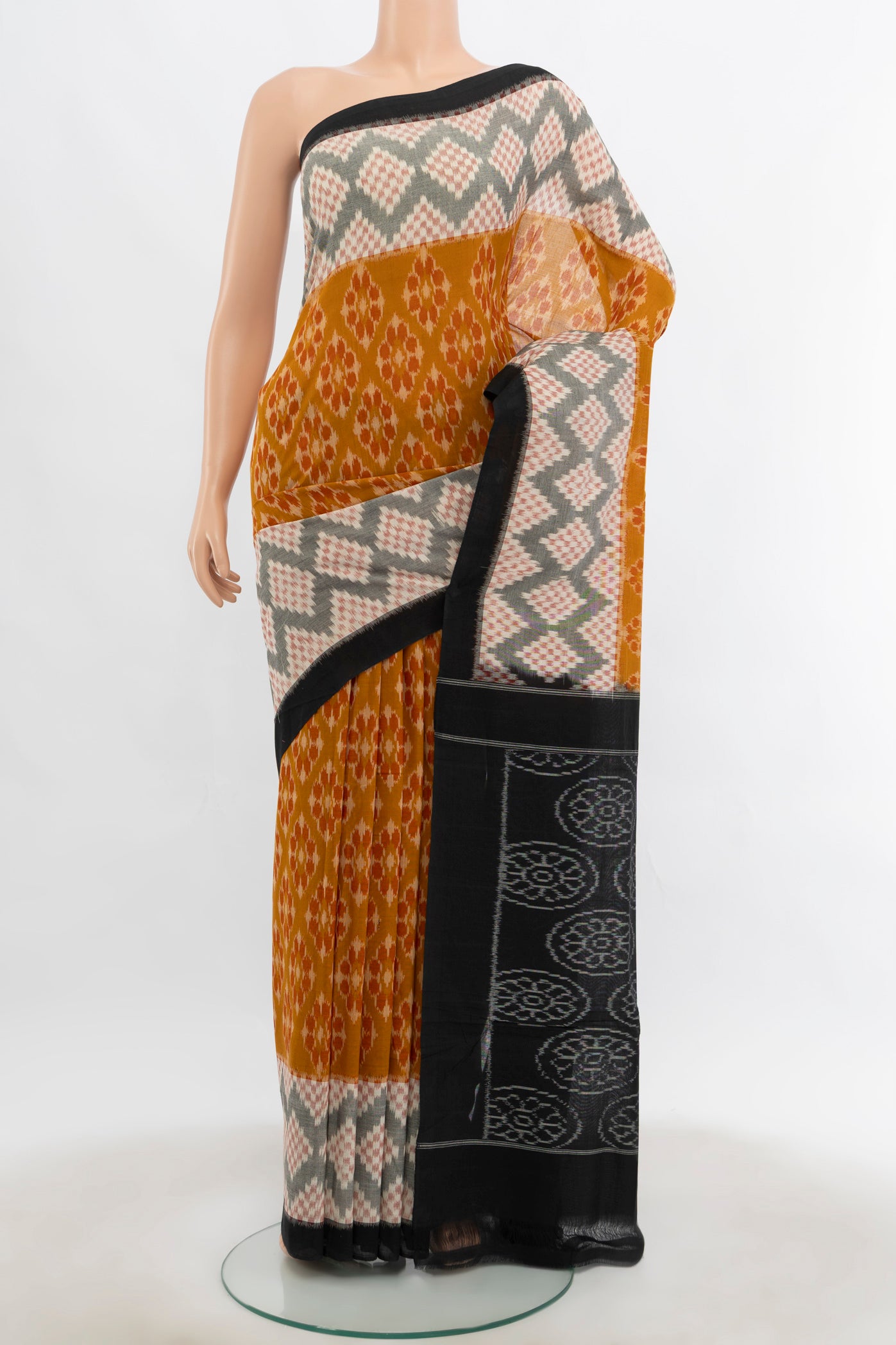Multi Color Pochampally Cotton Saree with Ikat Print on the body and Silk Border.  displayed on a mannequin